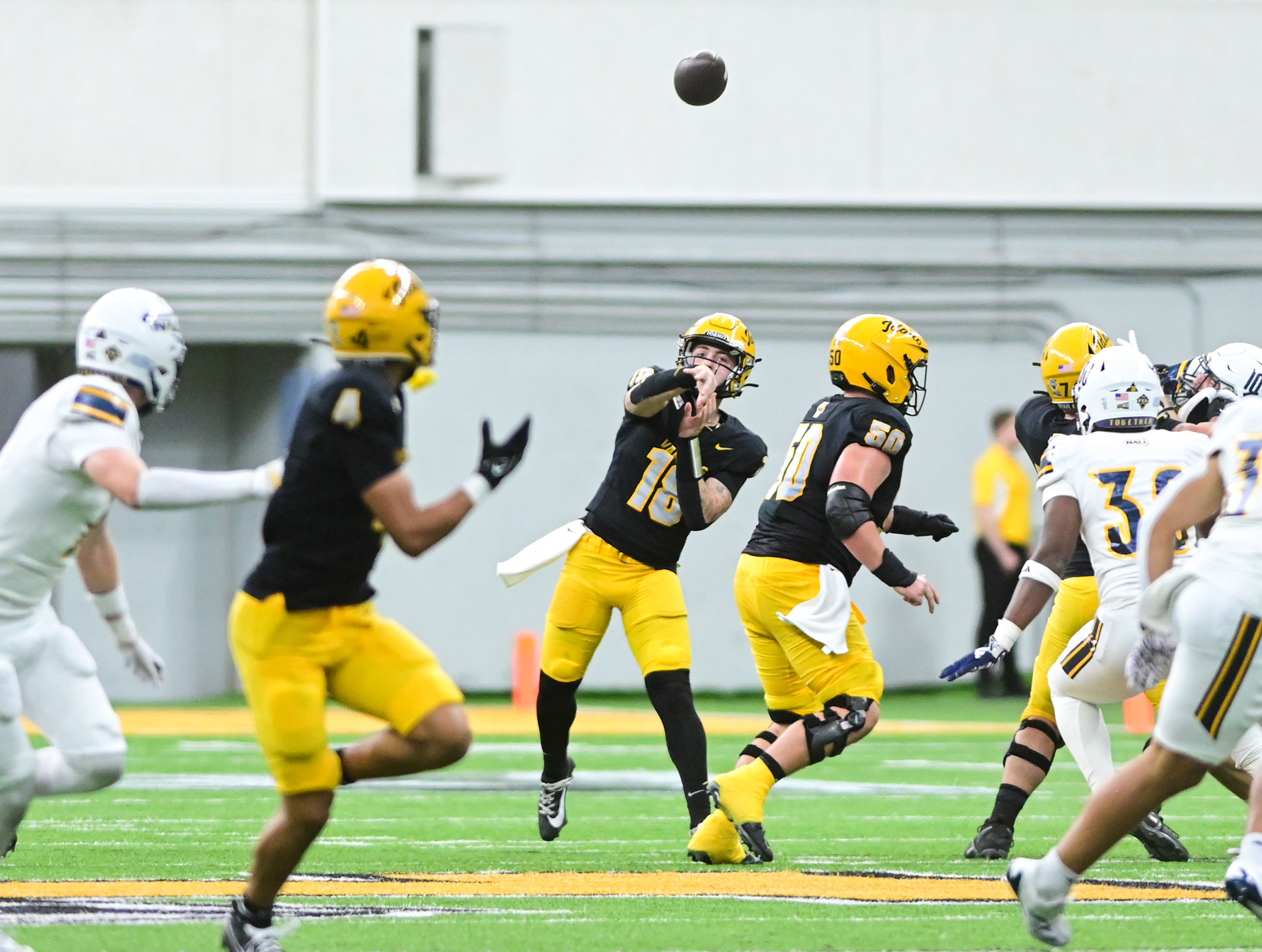 Idaho quarterback Nick Josifek releases a pass intended for Idaho wide receiver Tony Harste during a game against Northern Arizona Saturday at the P1FCU Kibbie Dome in Moscow.,