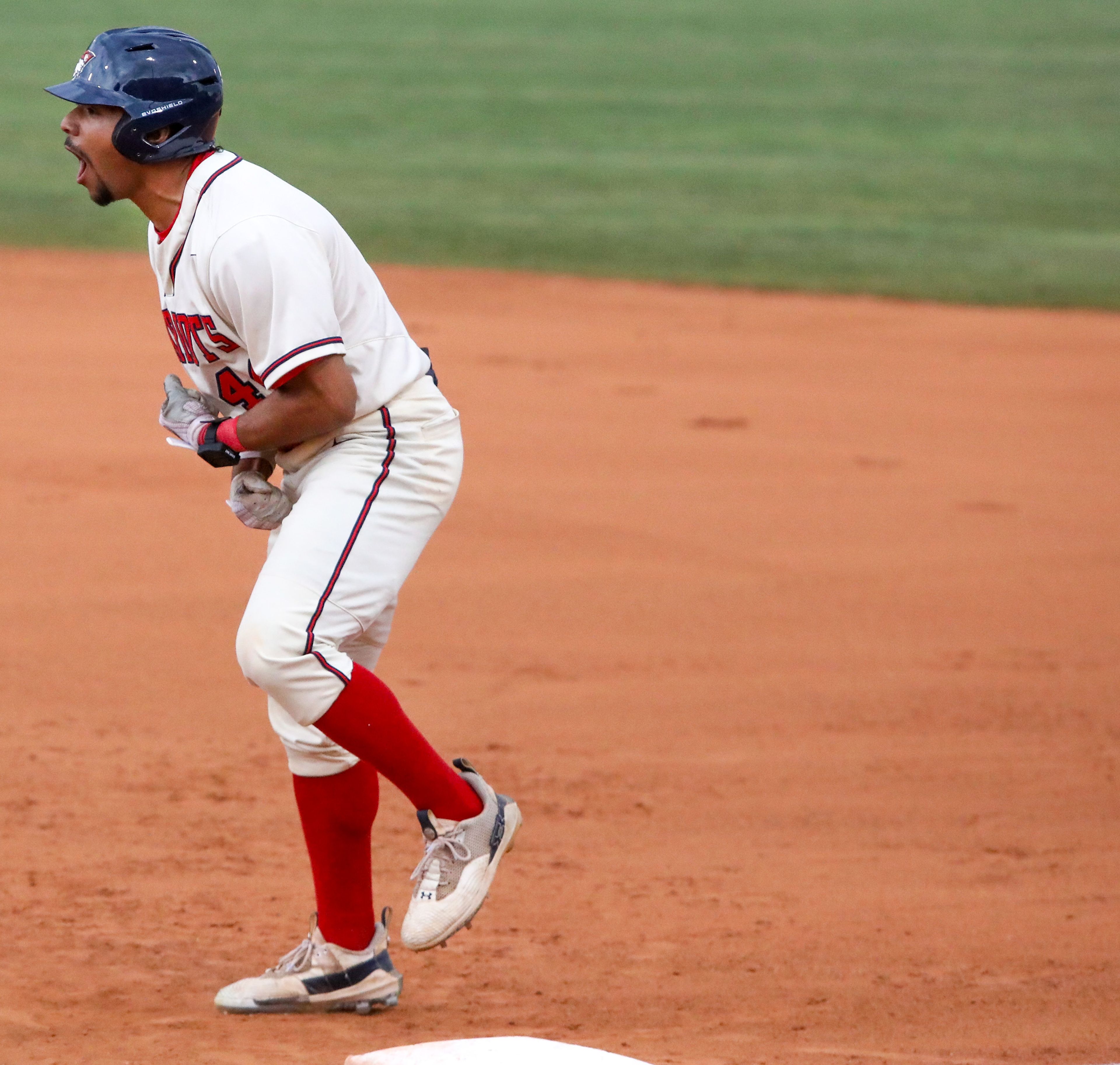 Cumberlands’ Christian Thompson celebrates a safe run to first base during a game against Tennessee Wesleyan on the opening day of the NAIA World Series at Harris Field in Lewiston on Friday.