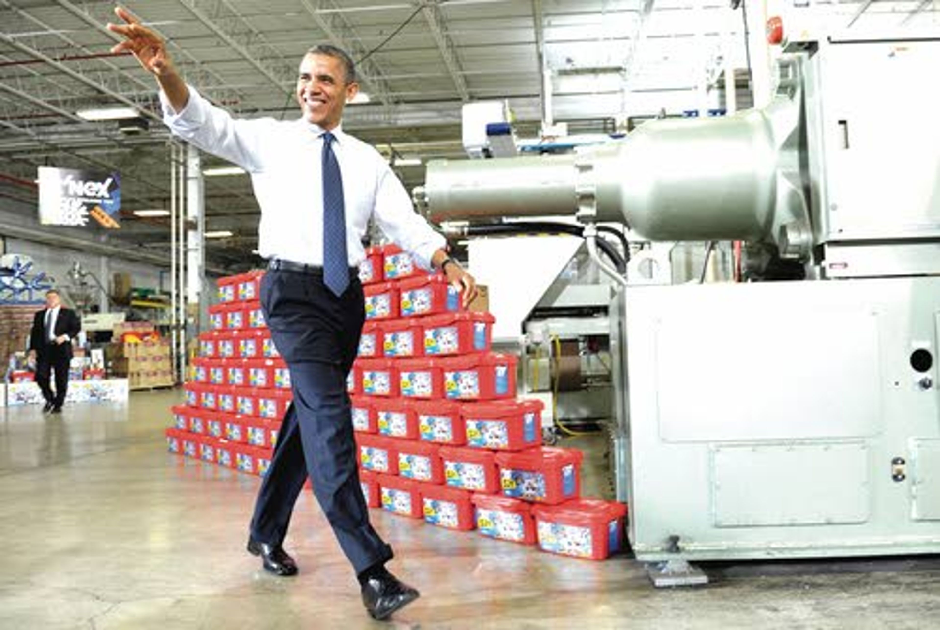 In this Nov. 30 photo, President Barack Obama waves as he arrives before speaking at the Rodon Group, a toy parts manufacturer in Hatfield, Pa.