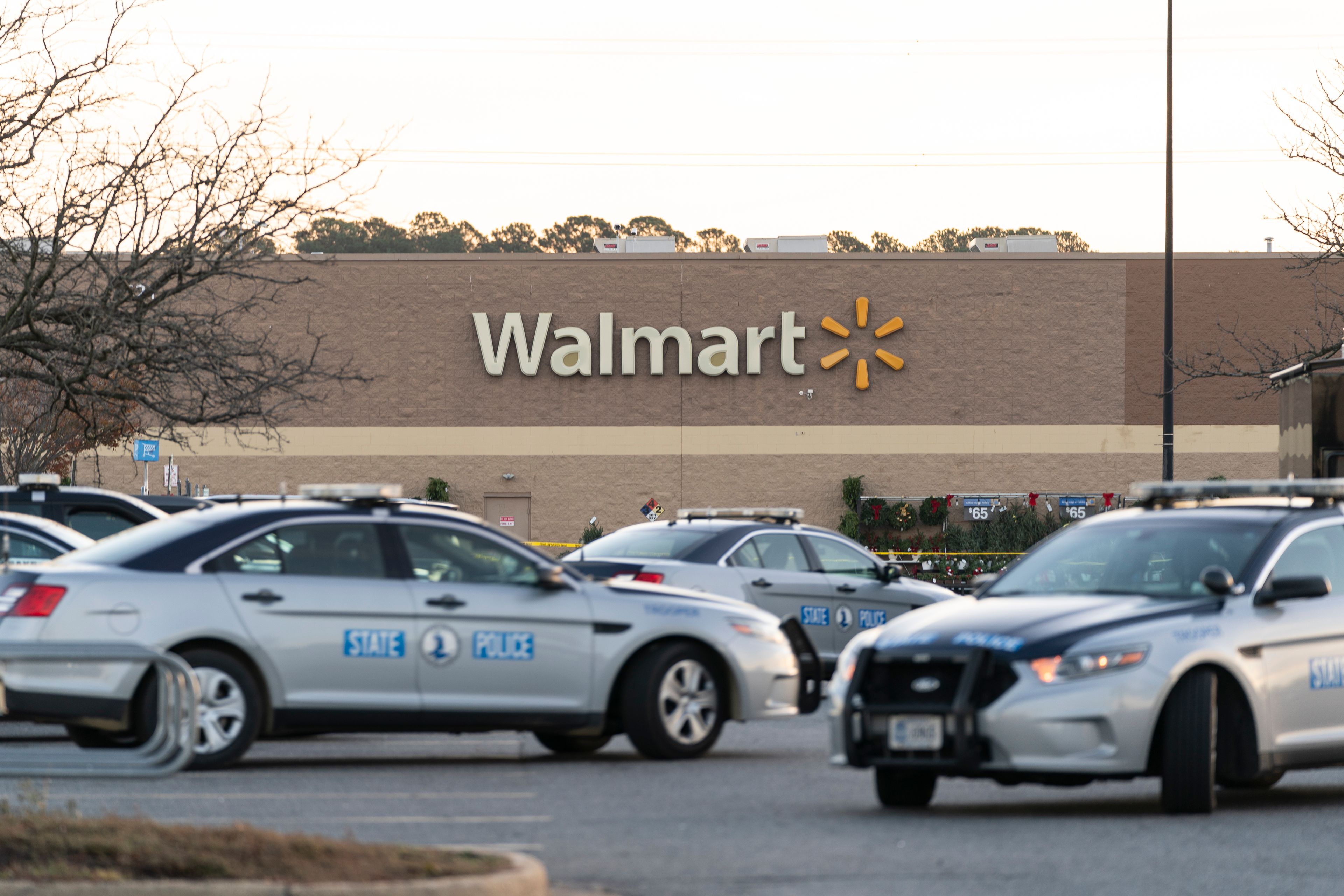 Law enforcement work the scene of a mass shooting at a Walmart, Wednesday, Nov. 23, 2022, in Chesapeake, Va. The store was busy just before the shooting Tuesday night with people stocking up ahead of the Thanksgiving holiday. (AP Photo/Alex Brandon)