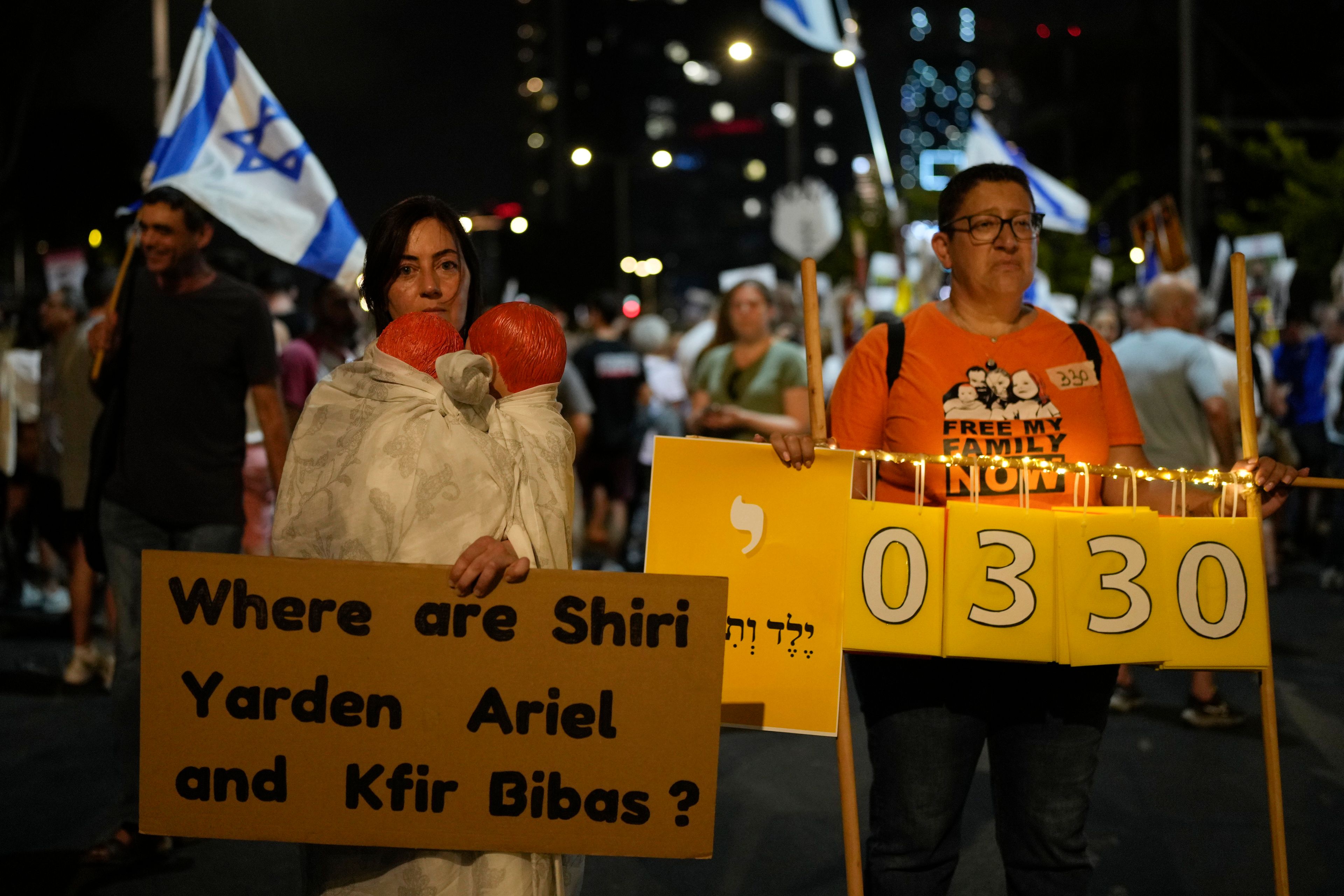 Activists and relatives of hostages held by Hamas militants in the Gaza Strip call for their immediate release and to protest against Israeli Prime Minister Benjamin Netanyahu's government in Tel Aviv, Israel, Saturday, Aug. 31, 2024. (AP Photo/Ohad Zwigenberg)