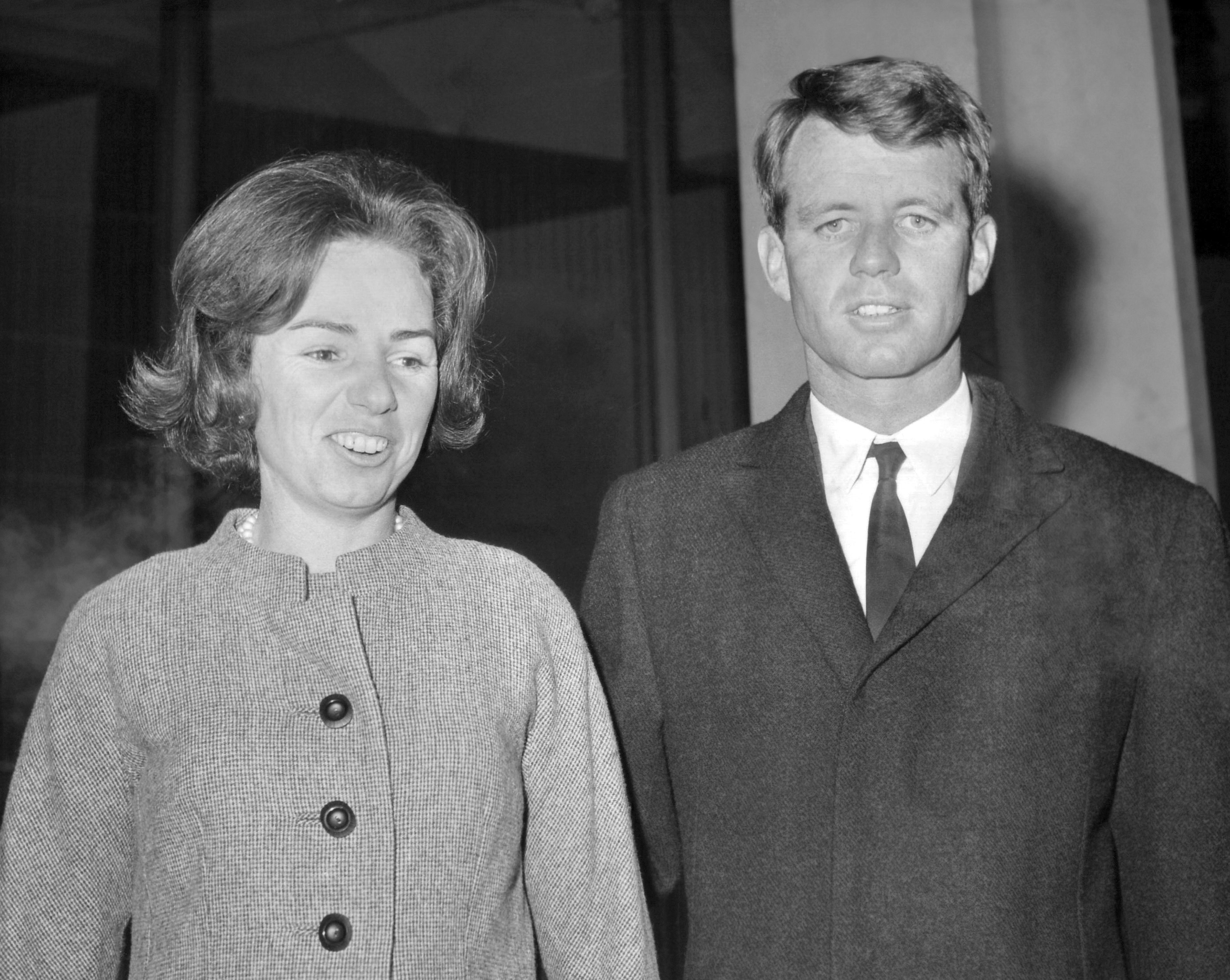 FILE - Robert F. Kennedy, 38-year-old American attorney general and brother of the late U.S. President, John F. Kennedy, is accompanied by his wife Ethel, leaving the U.S. Embassy for the airport in London, Jan. 25, 1964, to fly to Derbyshire to visit the grave of his sister who died in 1947 in a plane crash. (AP Photo/Laurence Harris, File)