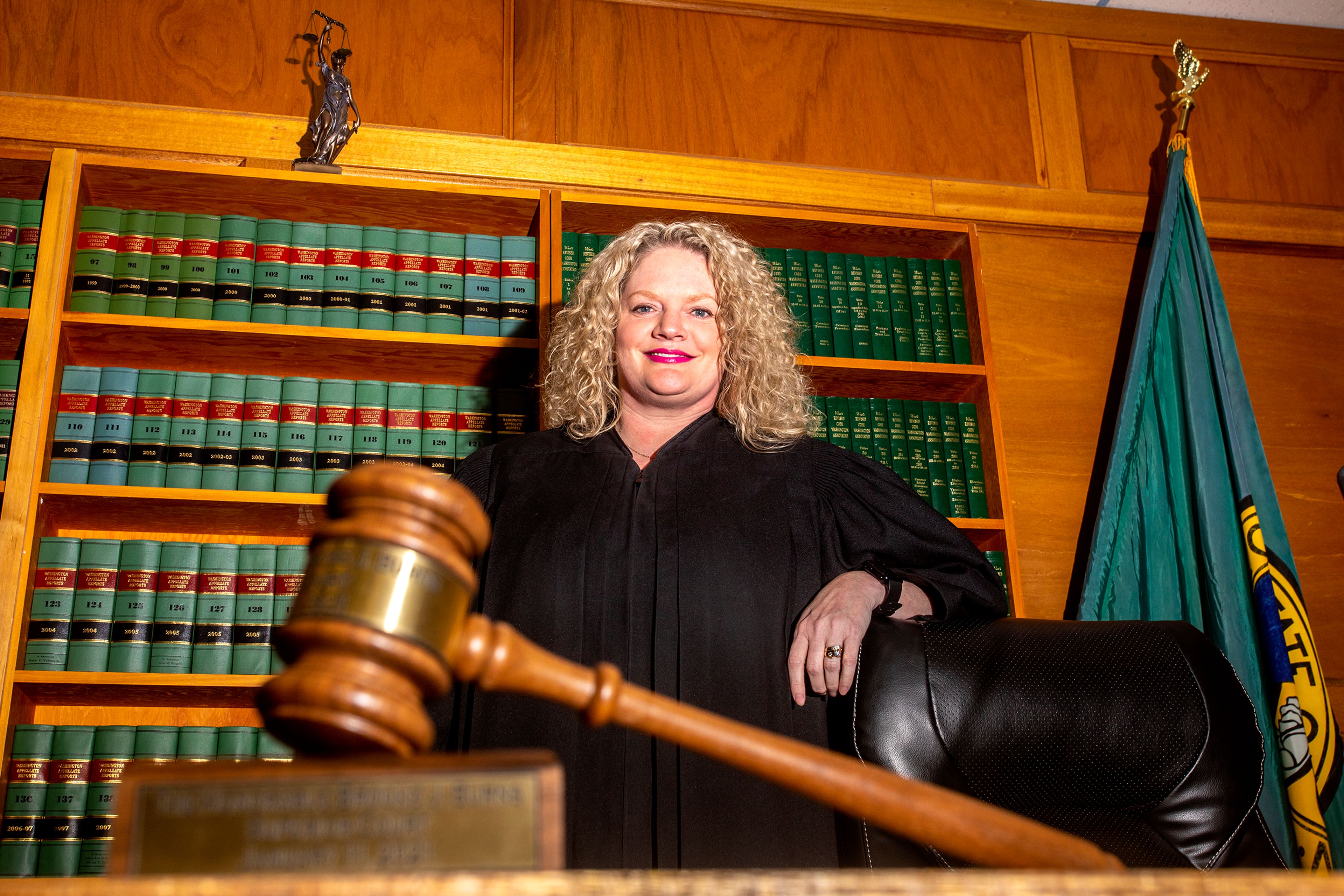 Judge Brooke Burns stands in the courtroom at Asotin County Superior Court for a portrait on Thursday.