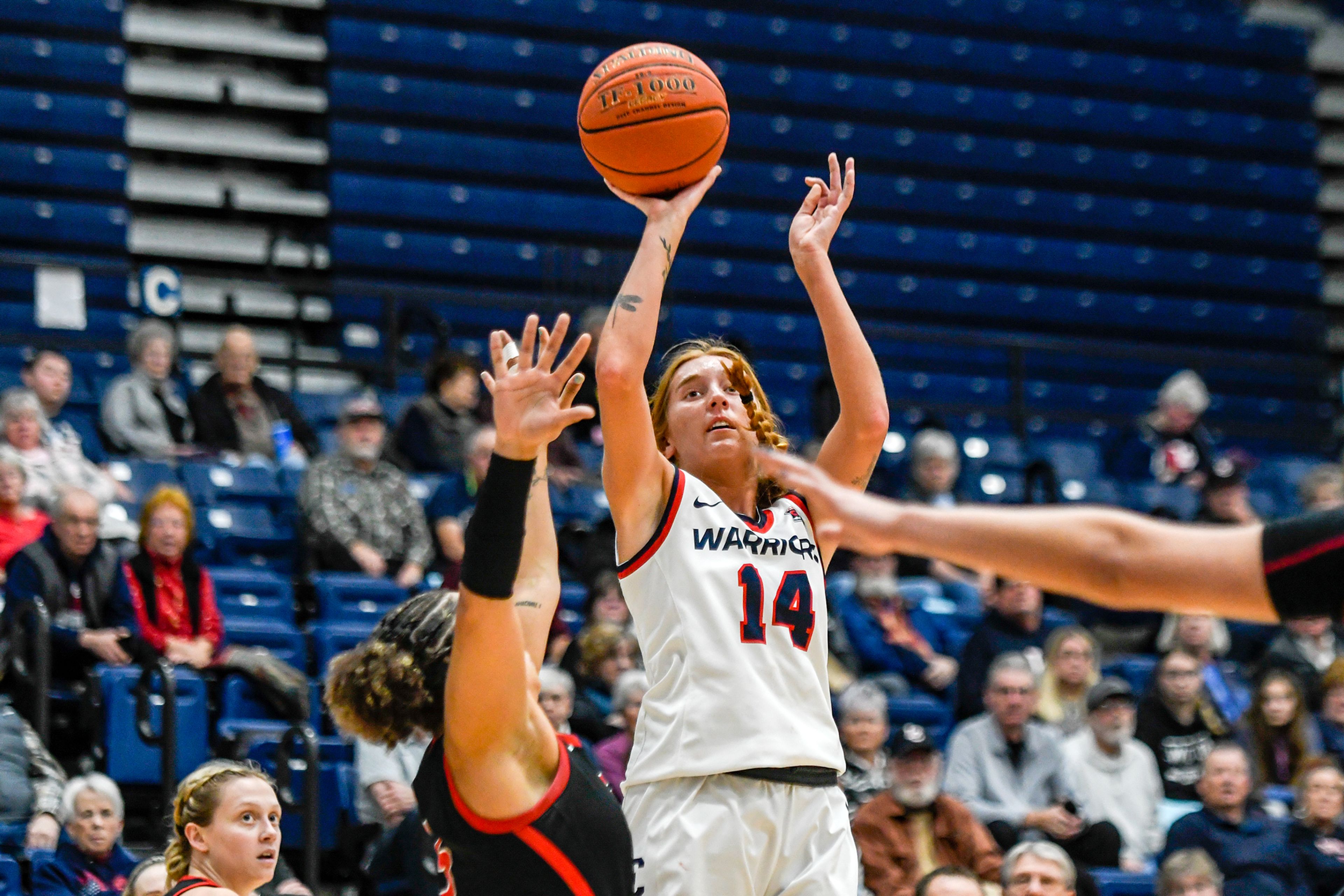 Lewis-Clark State forward Maddie Holm, center, shoots during Saturday's Cascade Conference game against Southern Oregon at the P1FCU Activity Center.