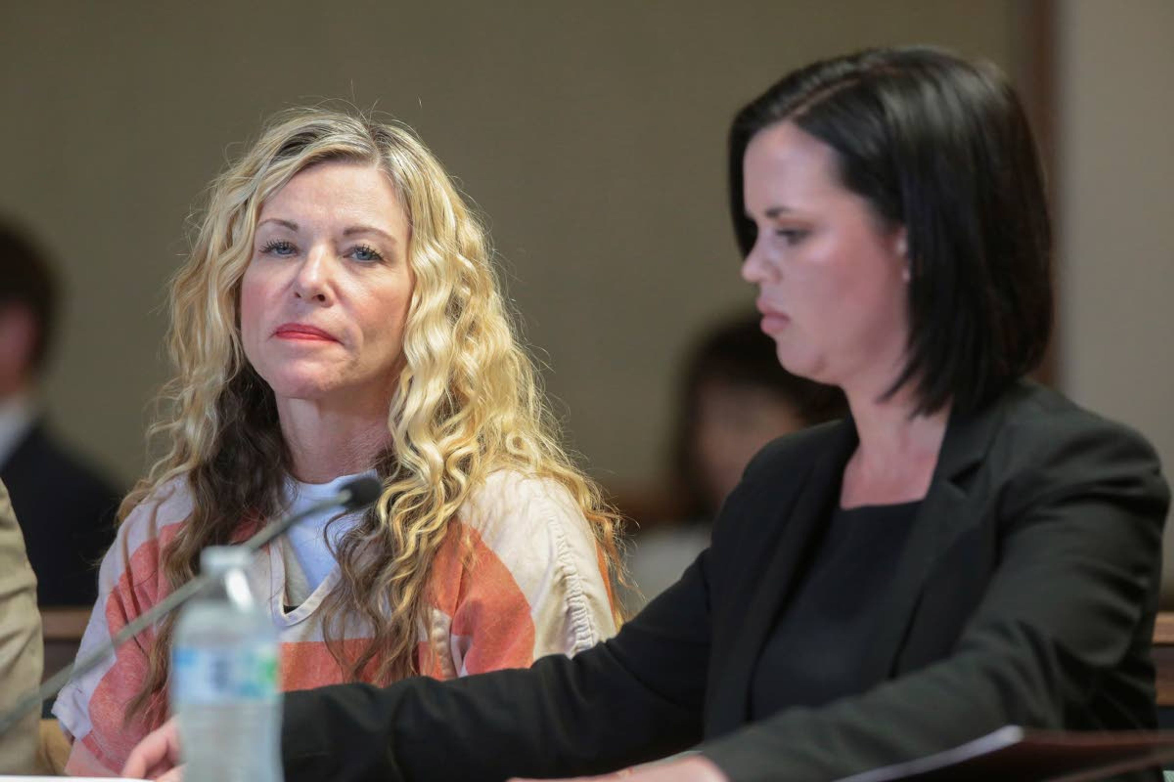 Lori Vallow Daybell (left) glances at the camera during her March 6 hearing in Rexburg, Idaho. At her right is defense attorney Edwina Elcox.