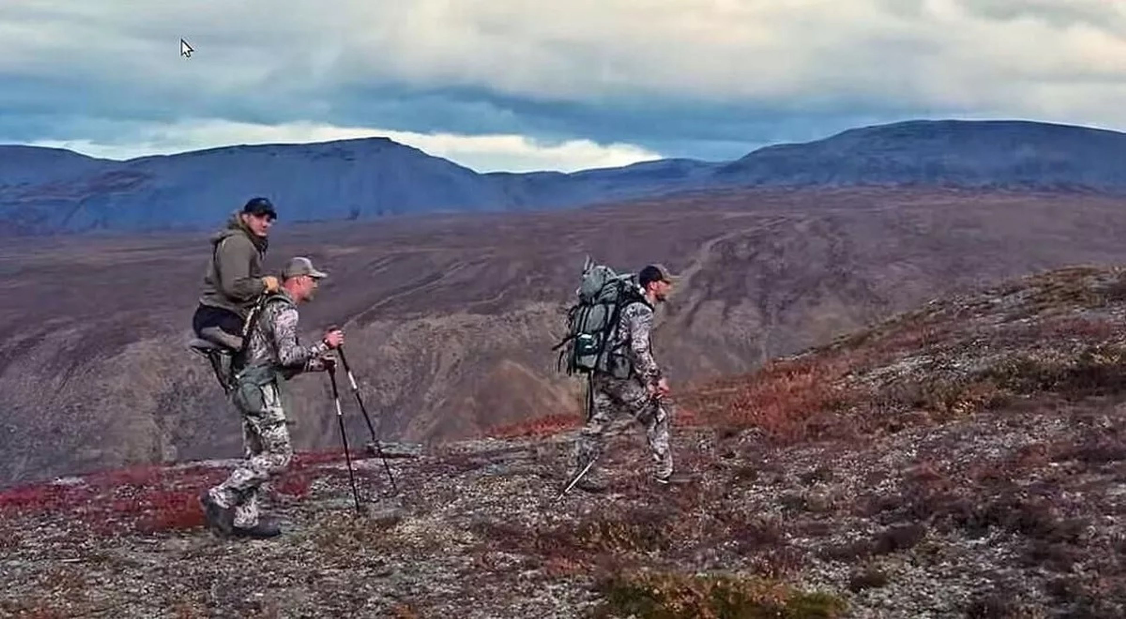 Outfitter and guide Cole Kramer carries his friend, Jonathon Blank, during a Dall sheep hunt in Canada’s Northwest Territory in August 2023.