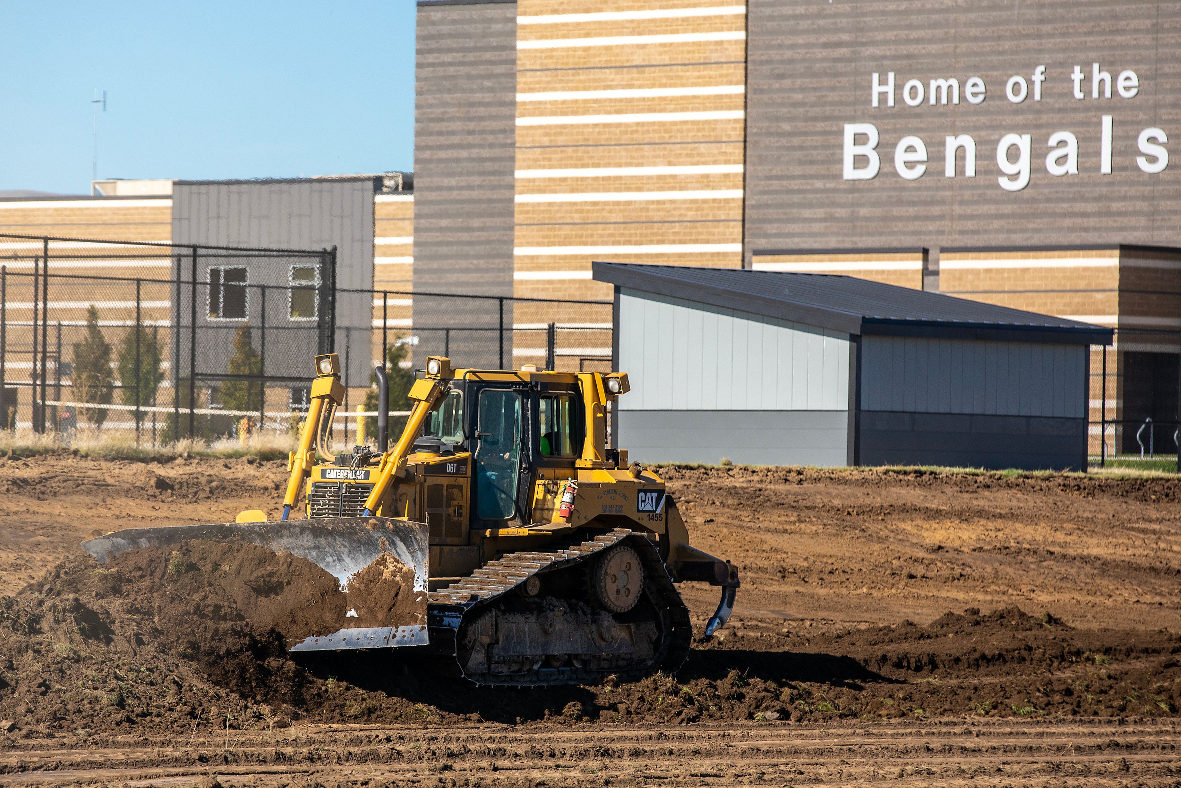 A bulldozer moves dirt at the future athletic fields Wednesday at Lewiston High School.