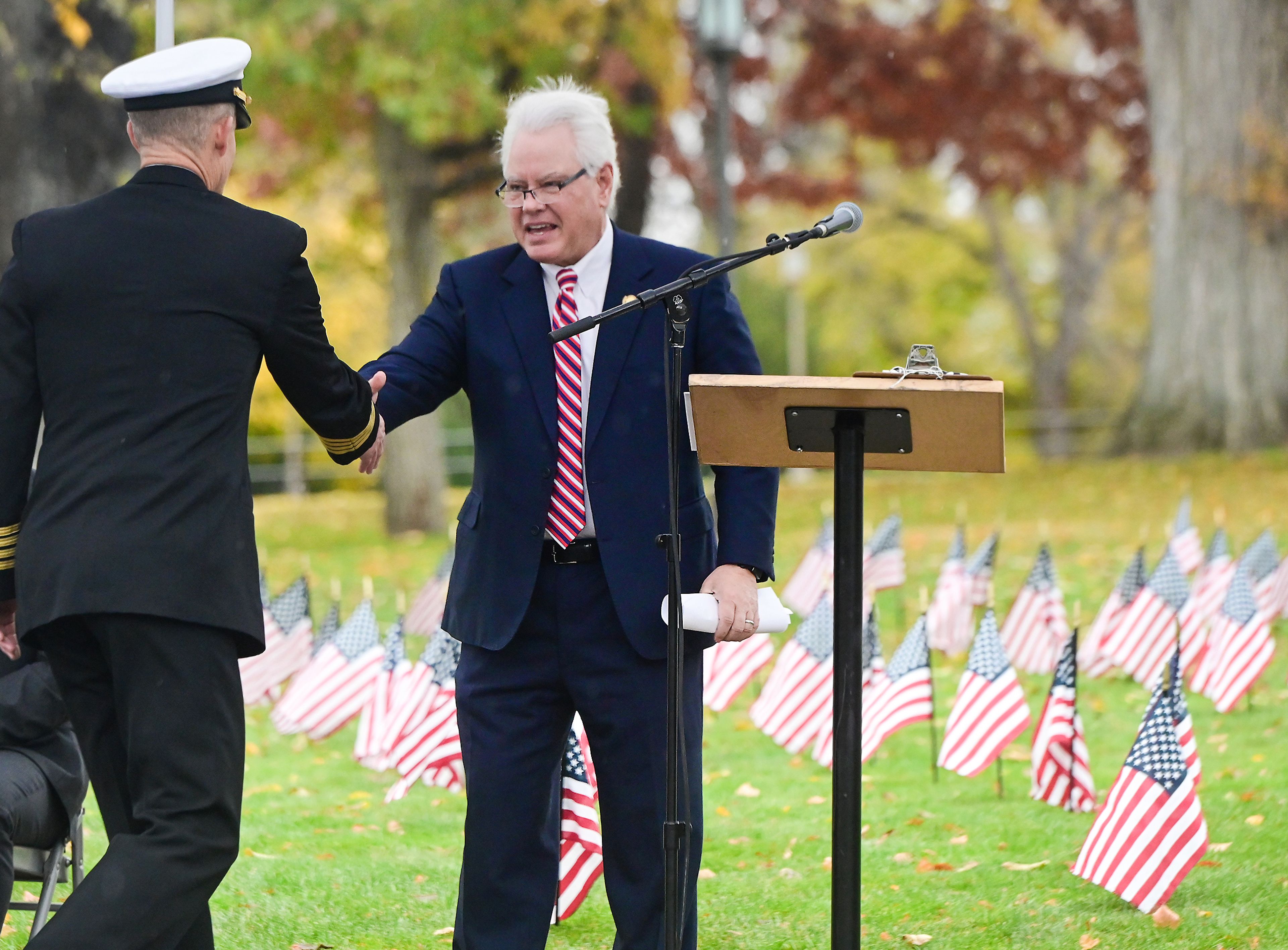 University of Idaho Navy ROTC commanding officer Scott Brunson, left, shakes hands with University of Idaho President C. Scott Green before speaking at the UI Veterans Day ceremony Monday in Moscow.