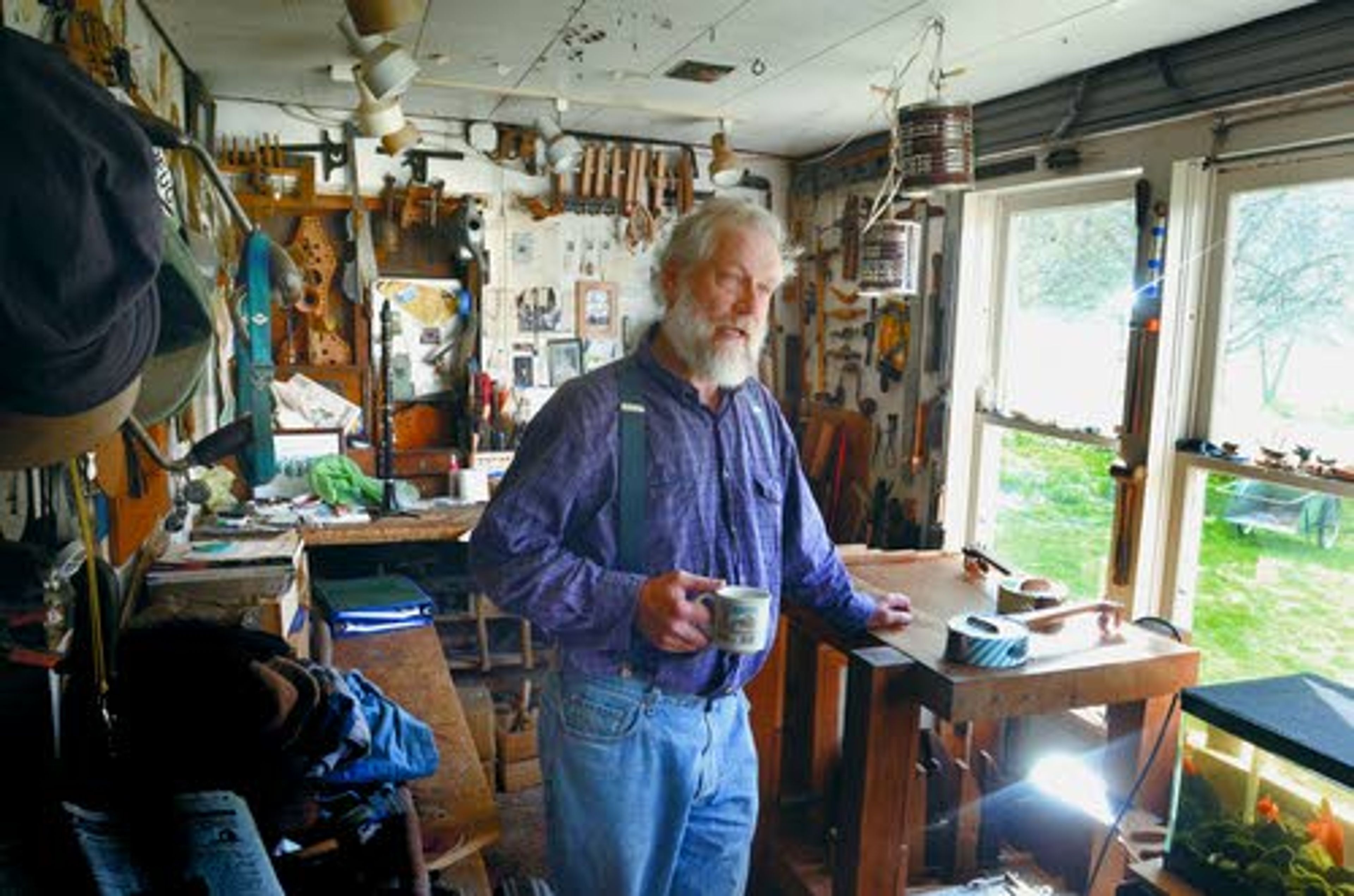 Tribune/Barry KoughLiving in the quiet country, John Elwood has a location seemingly made for creating musical instruments in his cozy, sunlit workshop.