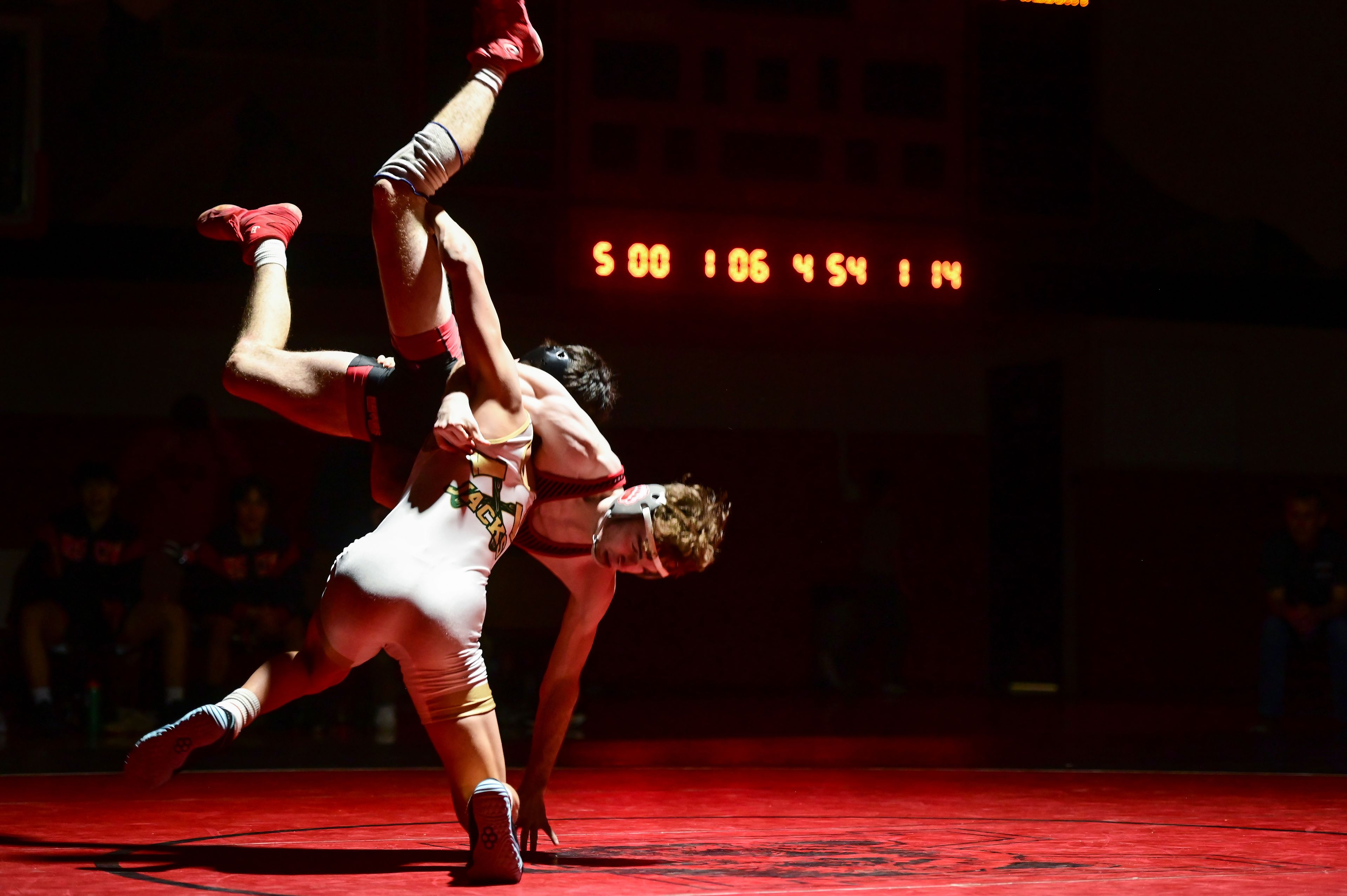 Moscow’s Sam Young is flipped by St. Maries’ Zachary David during a match Thursday at Bear Den in Moscow.