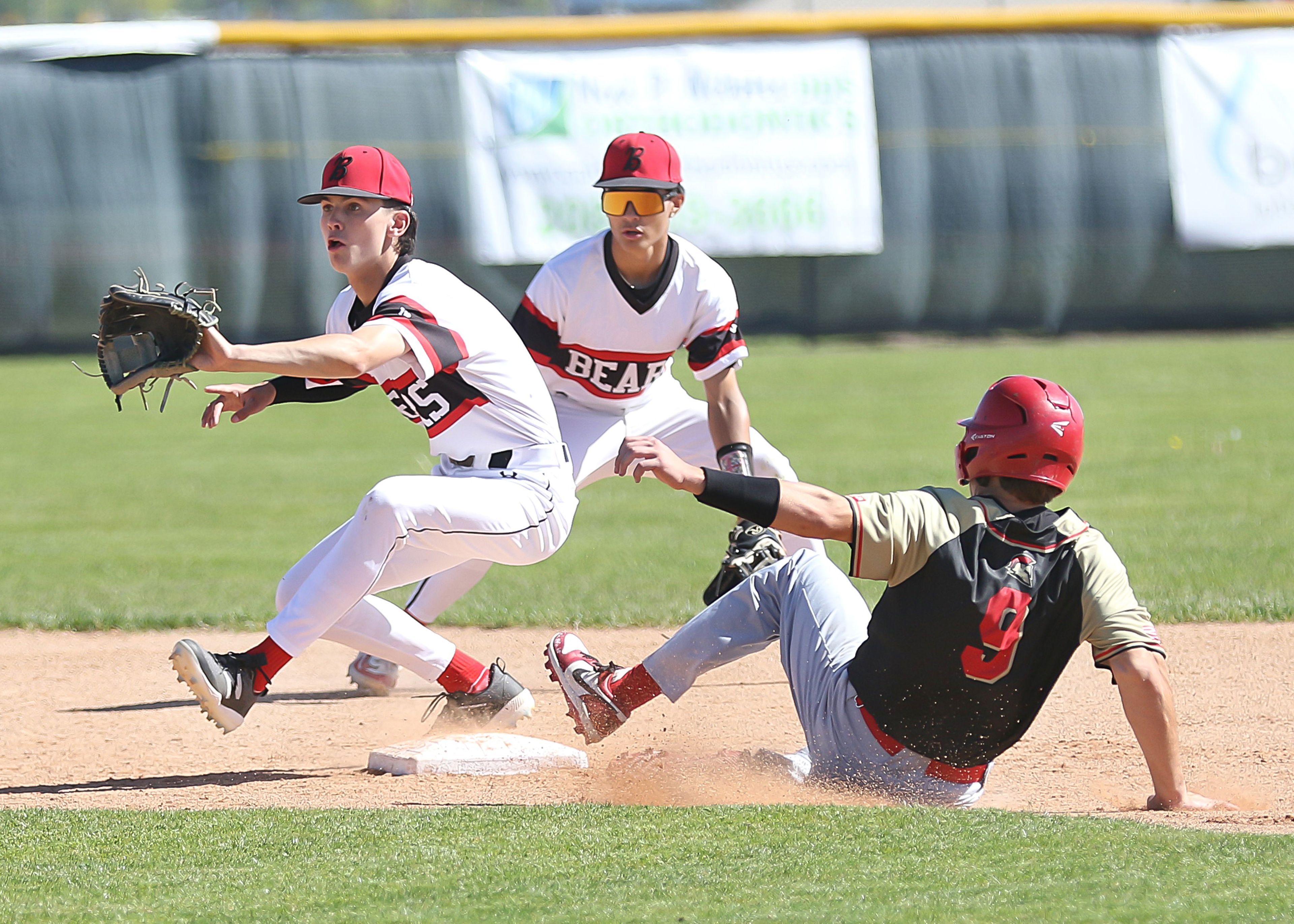 Moscow's Ollie Spencer catches a throw at second base for an out against Minico in an Idaho Class 4A state tournament game Thursday, May 16, 2024, at Vallivue High School in Caldwell.