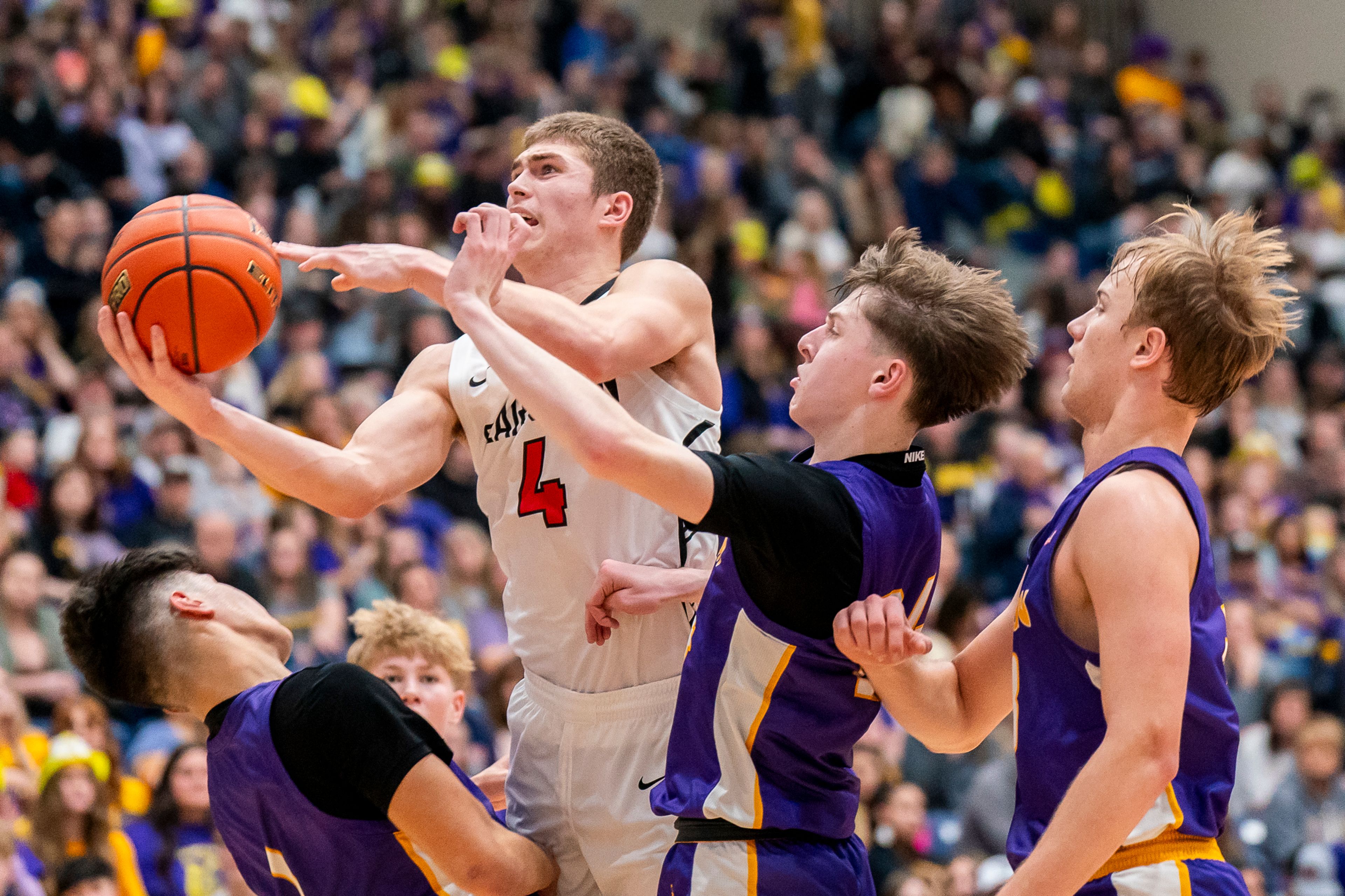 Clarkston’s Xander Van Tine (4) goes up for a layup during their Golden Throne rivalry game against Lewiston on Friday inside the P1FCU Activity Center in Lewiston.