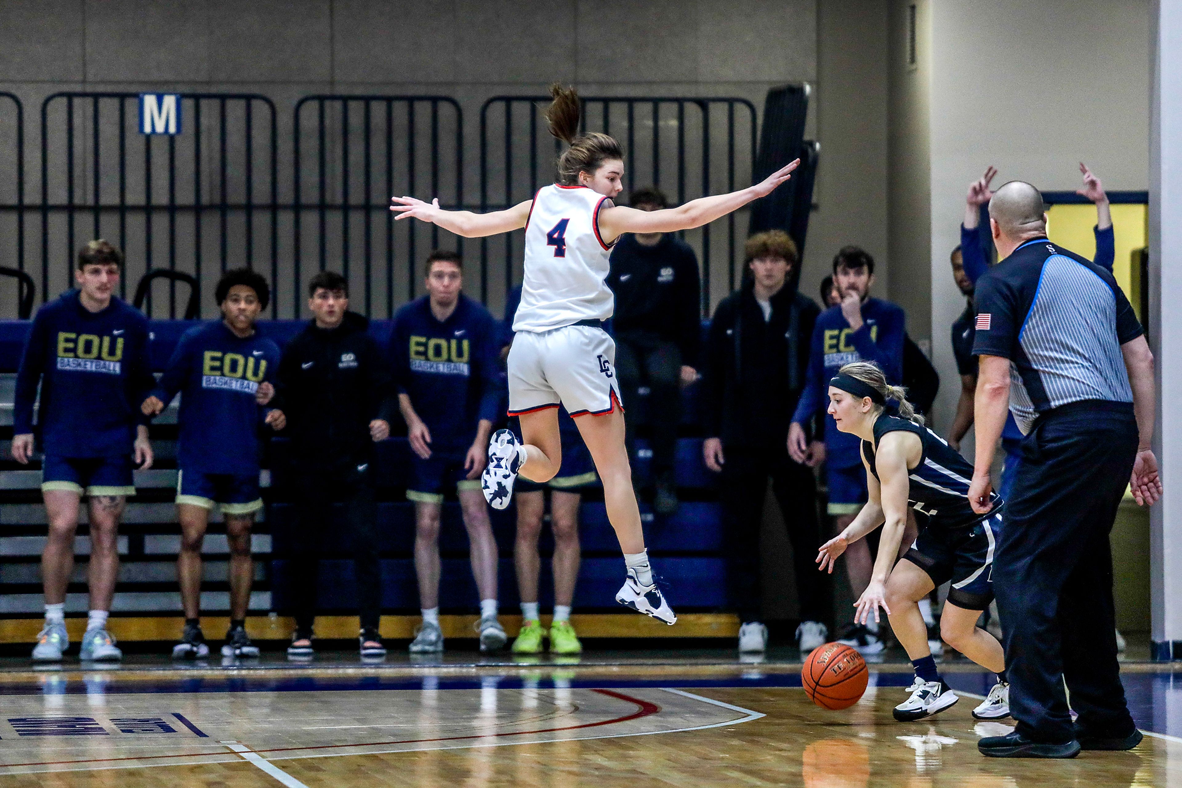 Lewis-Clark State guard Ellie Sander pressures Eastern Oregon guard Sailor Liefke on a 3-point attempt, which she missed, at the end of regulation of Friday's Cascade Conference game at Lewis-Clark State College.