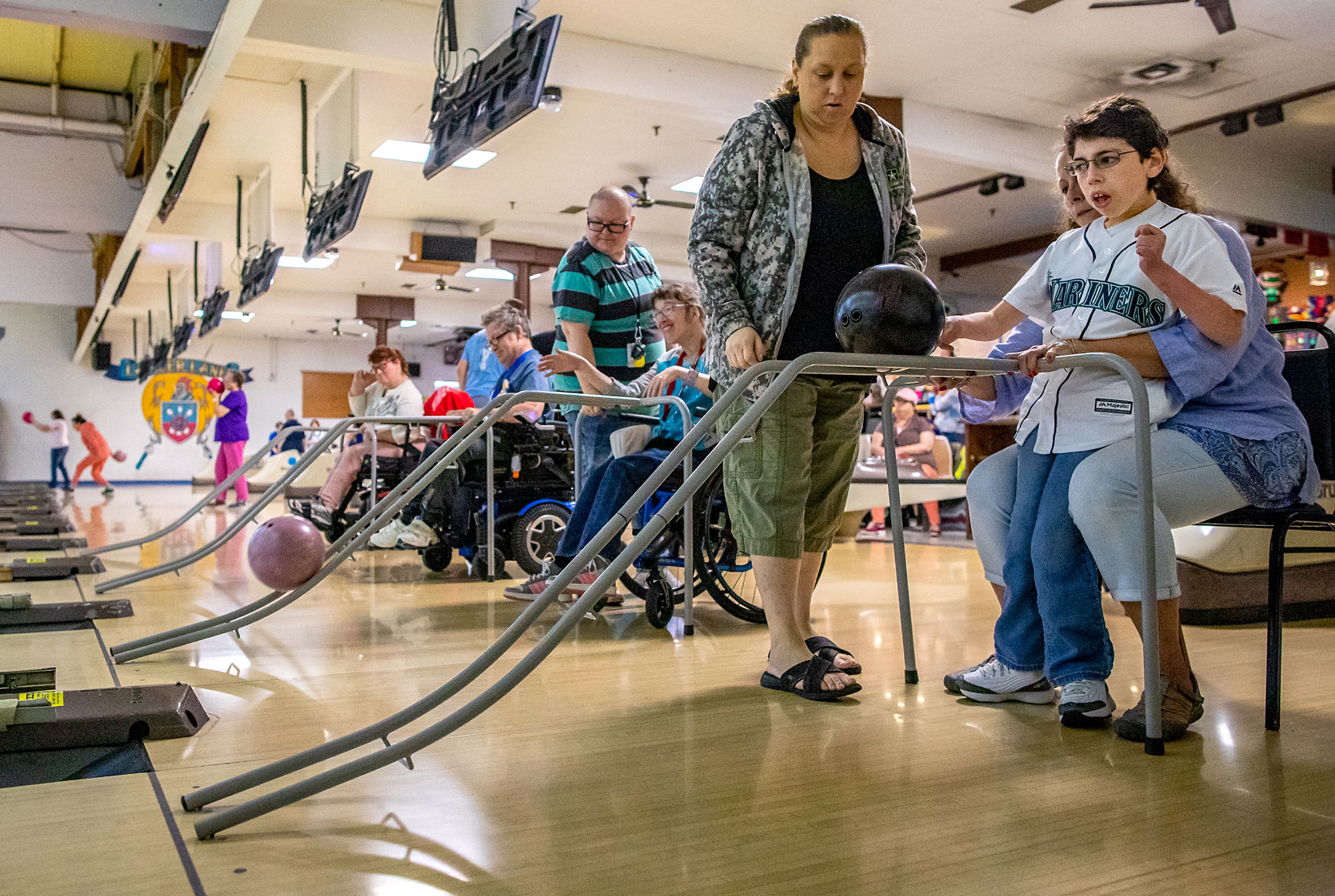 Ethan Brown, right, of the Twin Rivers Special Olympics of Washington, bowls a frame during a team practice Saturday morning at Lancer Lanes in Clarkston.