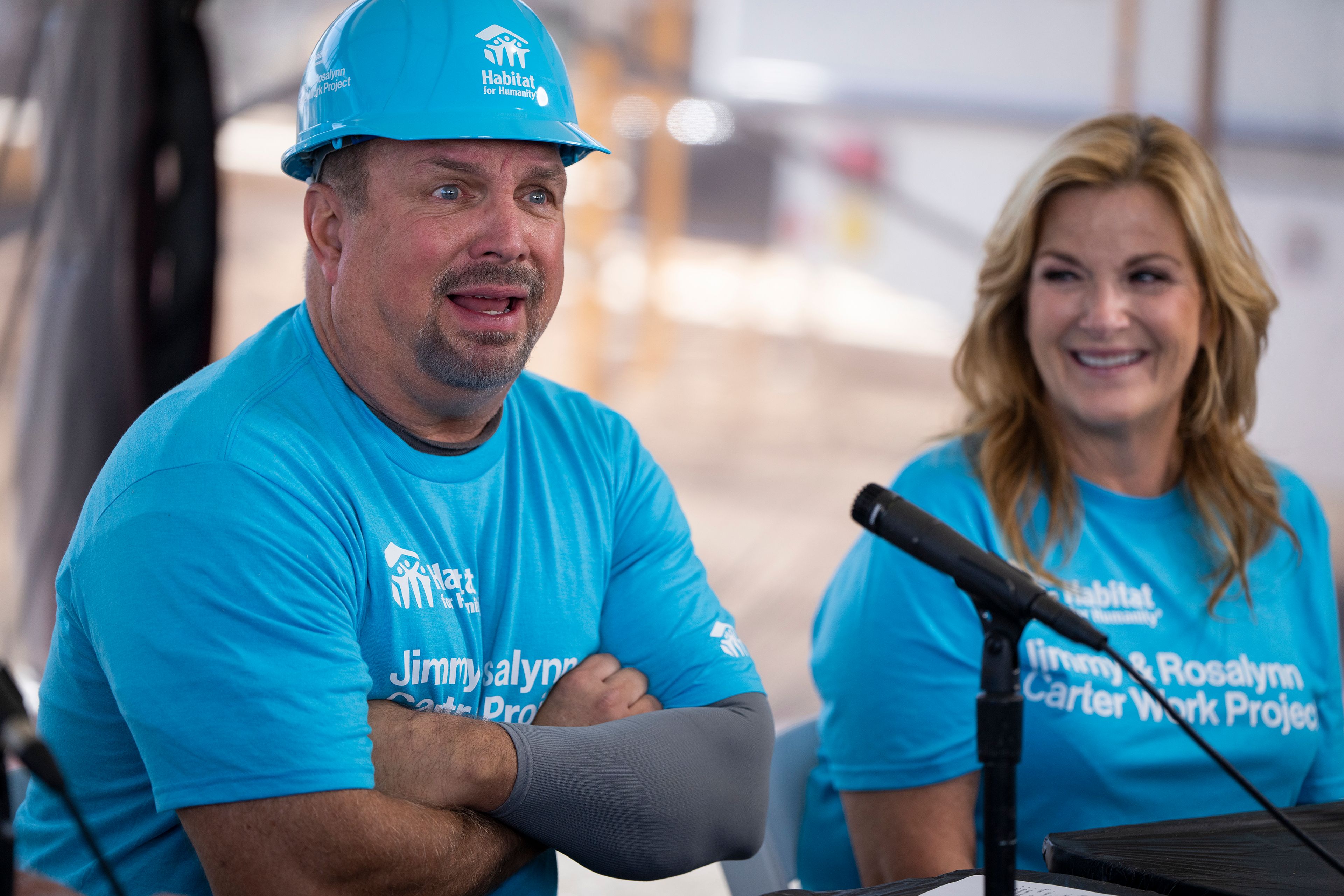 Garth Brooks and Trisha Yearwood speak during a press conference at Twin Cities Habitat for Humanity's 2024 Jimmy & Rosalynn Carter Work Project at the site of the former Hillcrest Golf Course in St. Paul, Minn. on Monday, Sept. 30, 2024. (Leila Navidi /Star Tribune via AP)