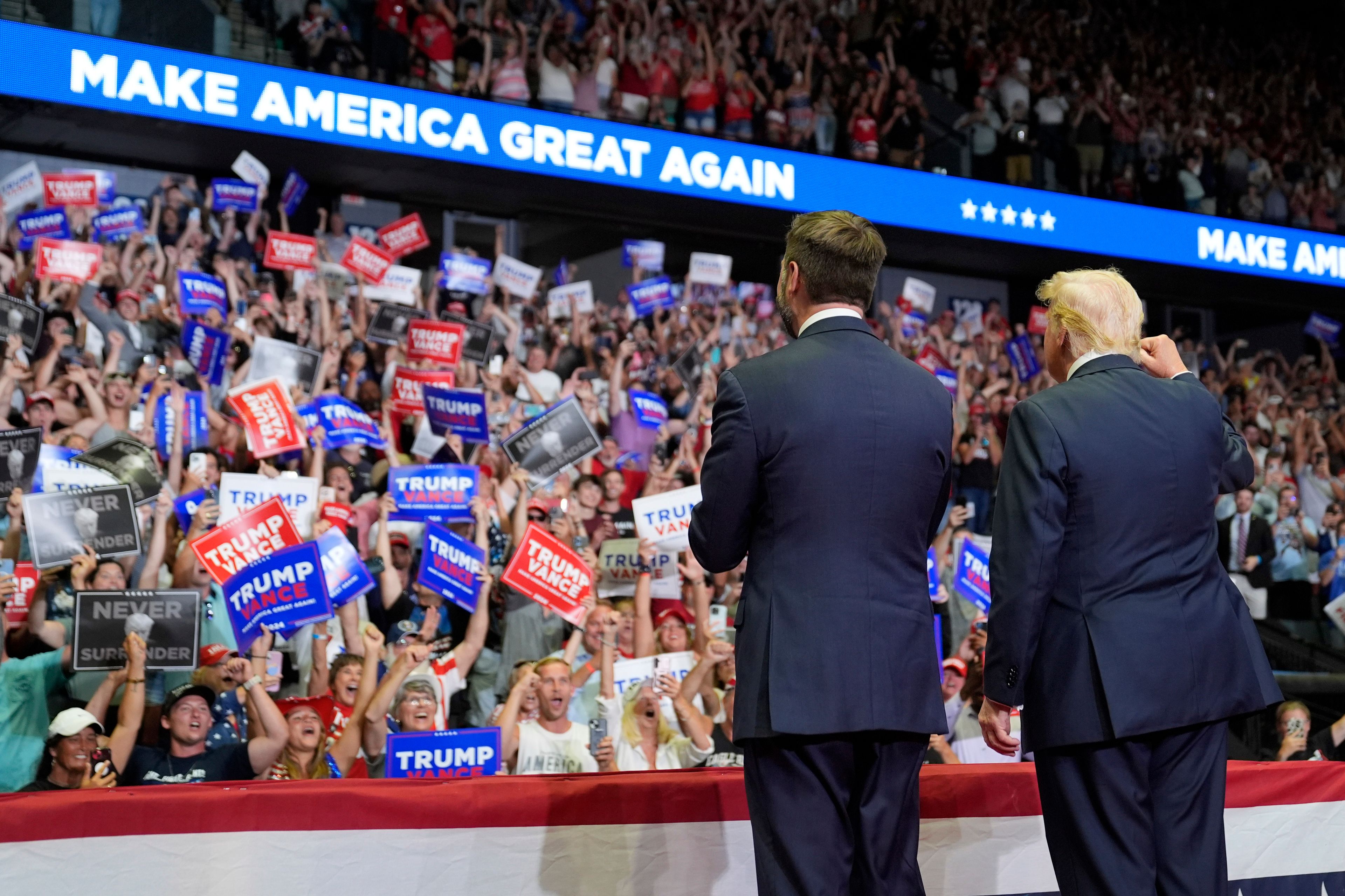 FILE - Republican presidential nominee former President Donald Trump and Republican vice presidential nominee Sen. JD Vance, R-Ohio, arrive a campaign rally, July 20, 2024, in Grand Rapids, Mich. (AP Photo/Evan Vucci)