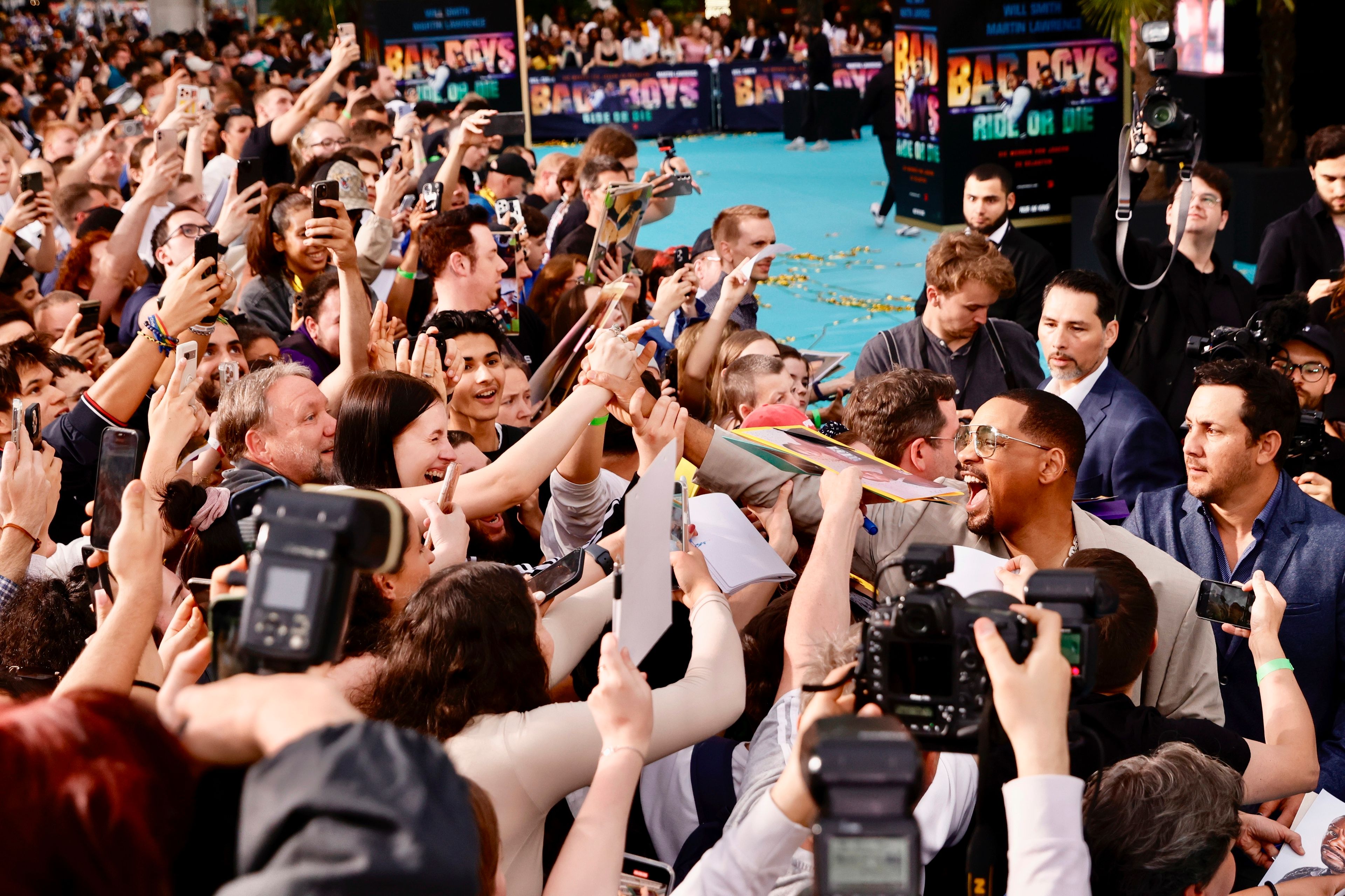 Actor Will Smith meets fans as he attends the European premiere of the film "Bad Boys: Ride or Die" at the Zoo Palast in Berlin, Monday May 27, 2024.