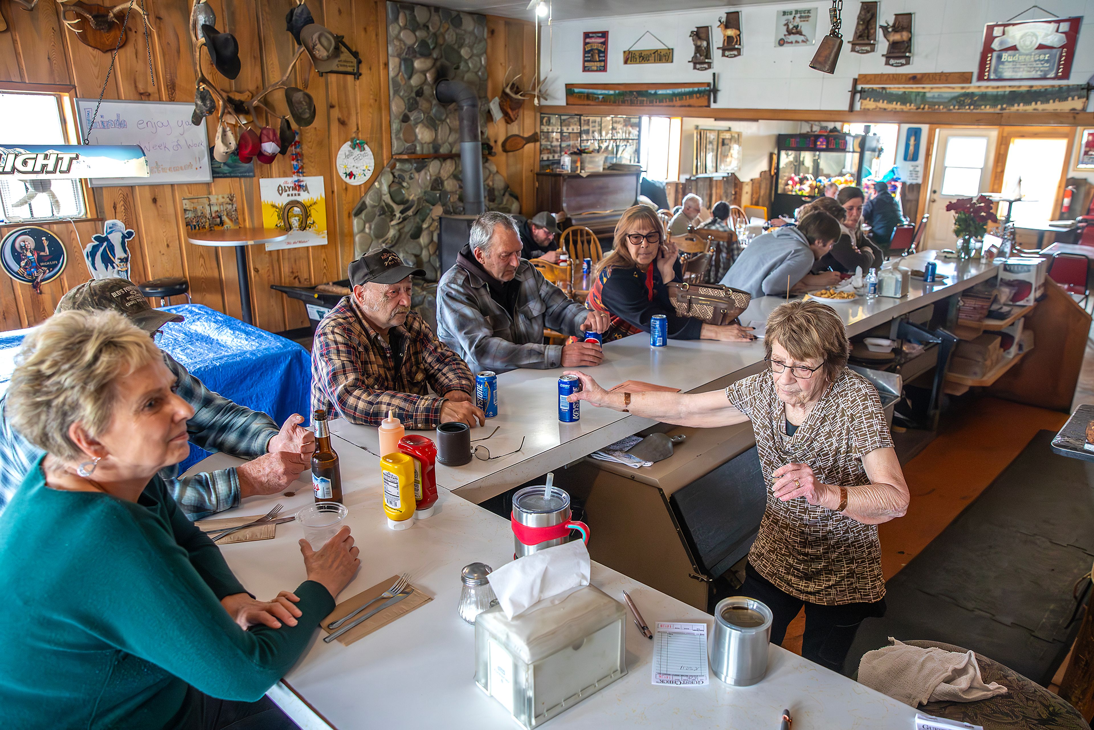 Linda Elliott gives Erb Schnider another beer Thursday at the Keuterville Pub & Grub.