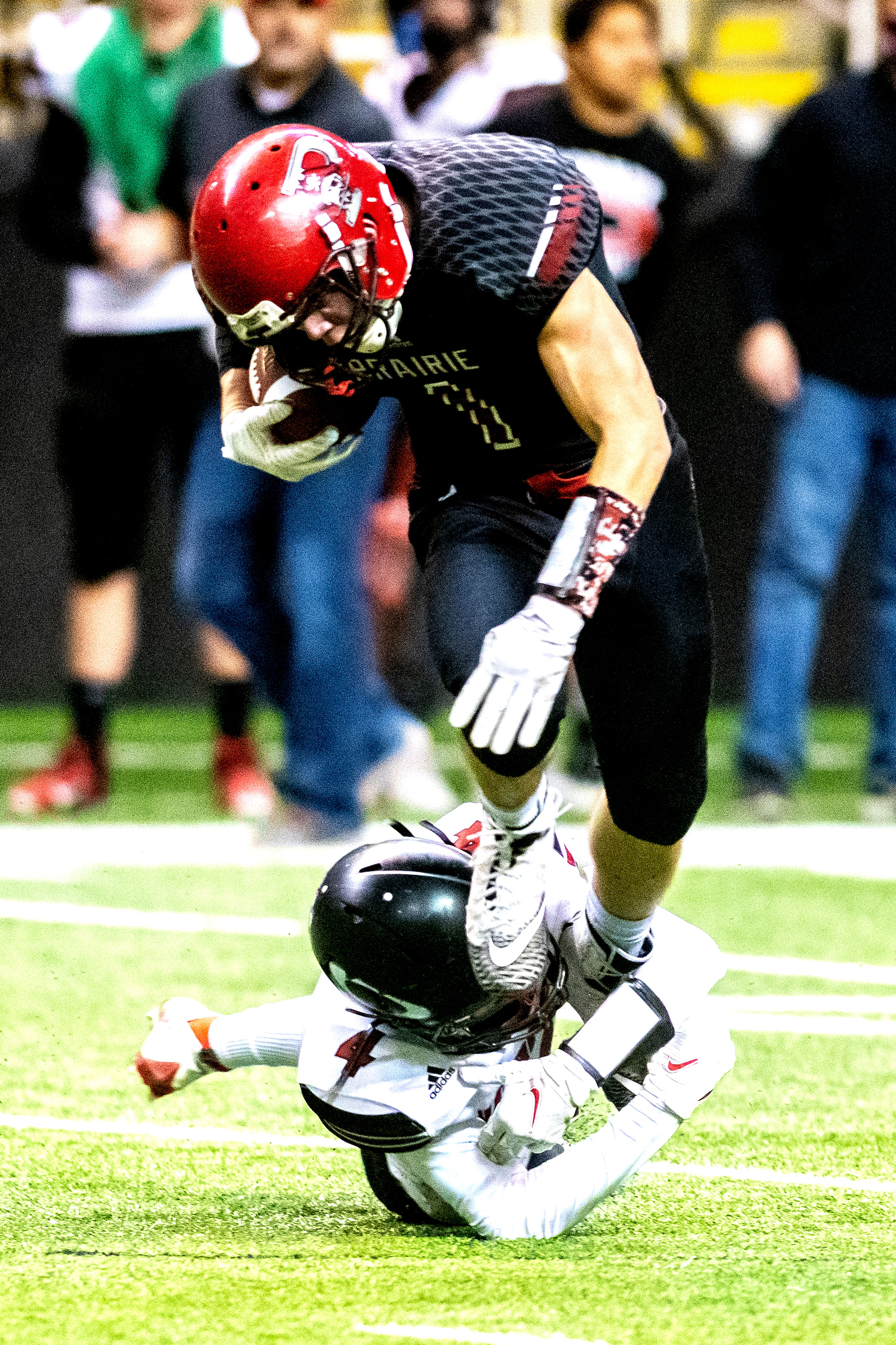 Prairie’s Tayden Hibbard leaps out of Austin Cranney’s hold. The Prairie Pirates lost to the Oakley Hornets 42-40 in the Class 1A Division O state semifinal football game at the Kibbie Dome in Moscow on Friday.