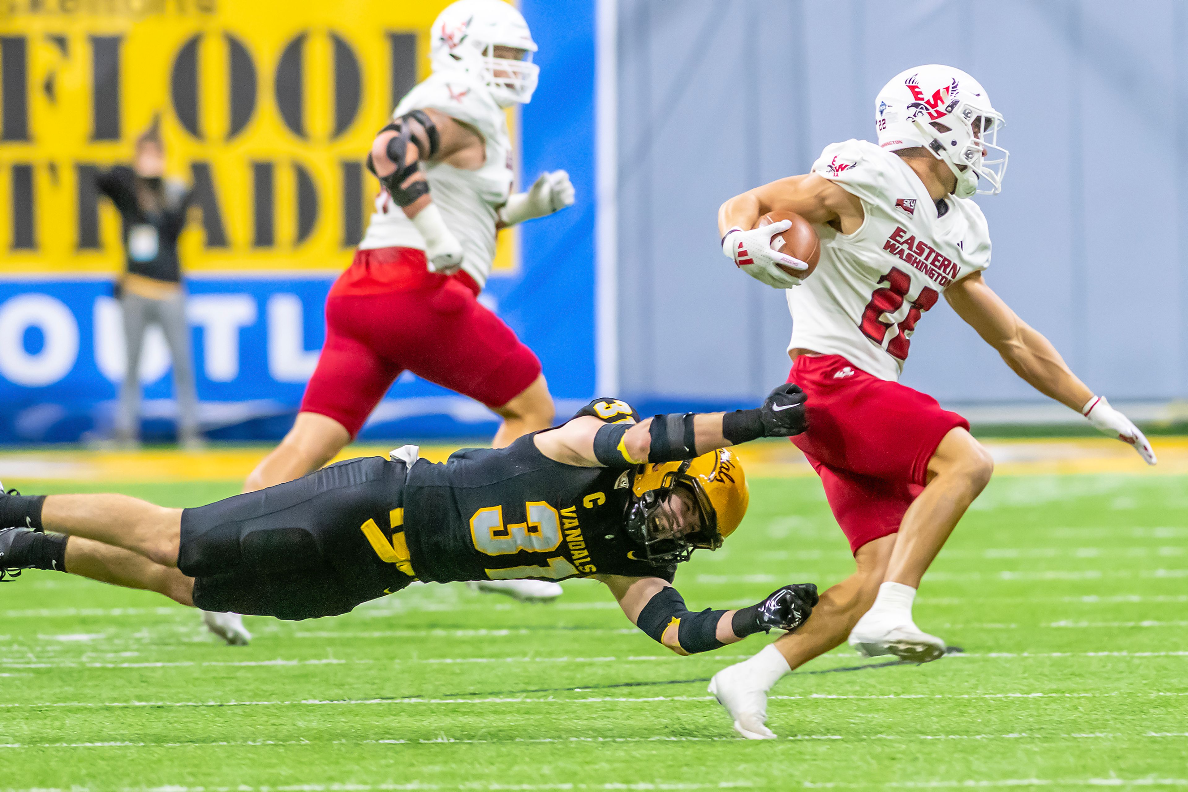 Idaho linebacker Mathias Bertram attempts to tackle Eastern Washington wide receiver Noah Cronquist during a Big Sky game Oct. 26 at the Kibbie Dome in Moscow. 