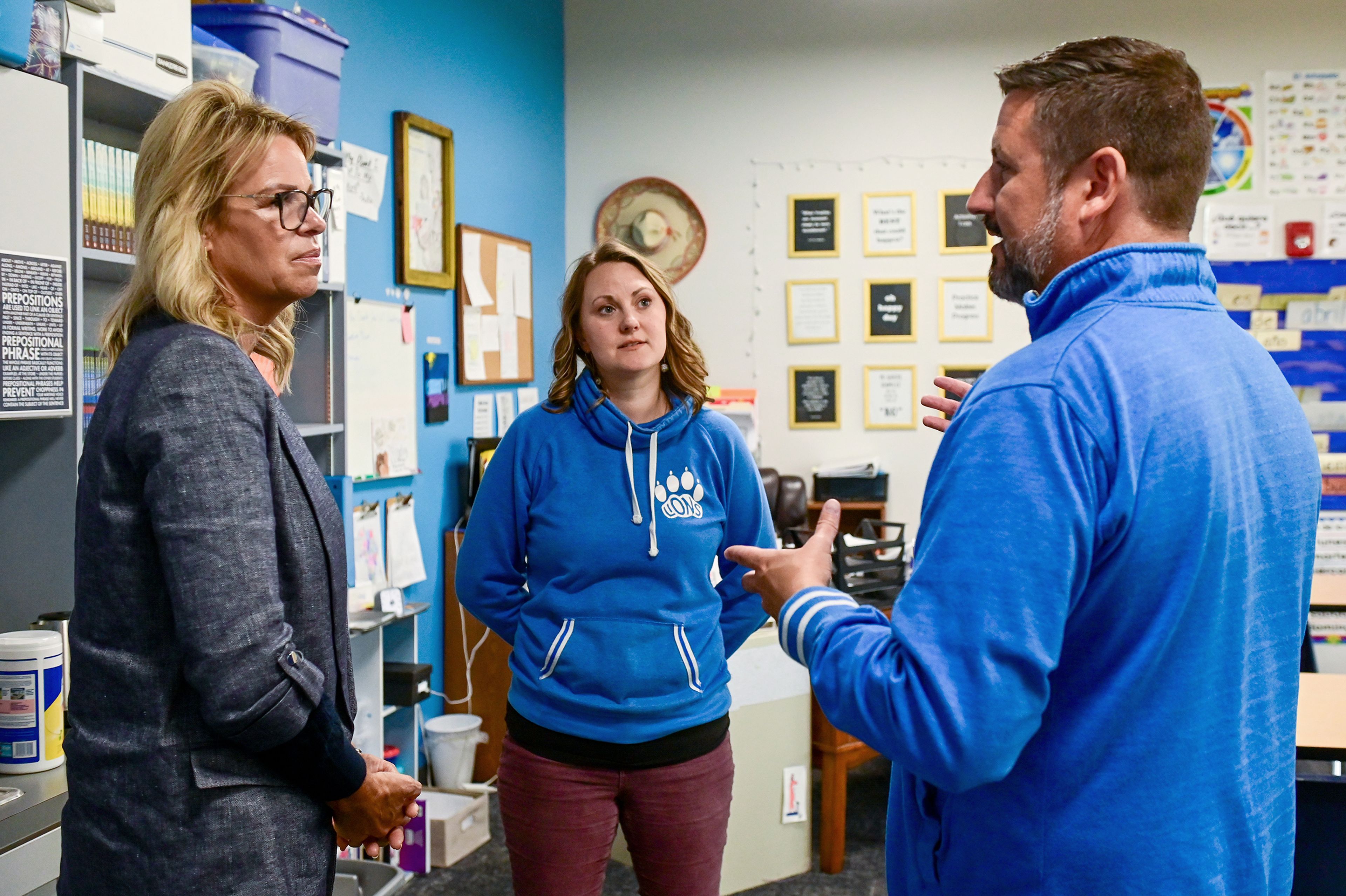 Idaho Superintendent of Public Instruction Debbie Critchfield, left, Moscow Charter School English language arts teacher Macy Swift, center, and principal Tony Bonuccelli talk during Critchfields tour of the school Friday in Moscow.