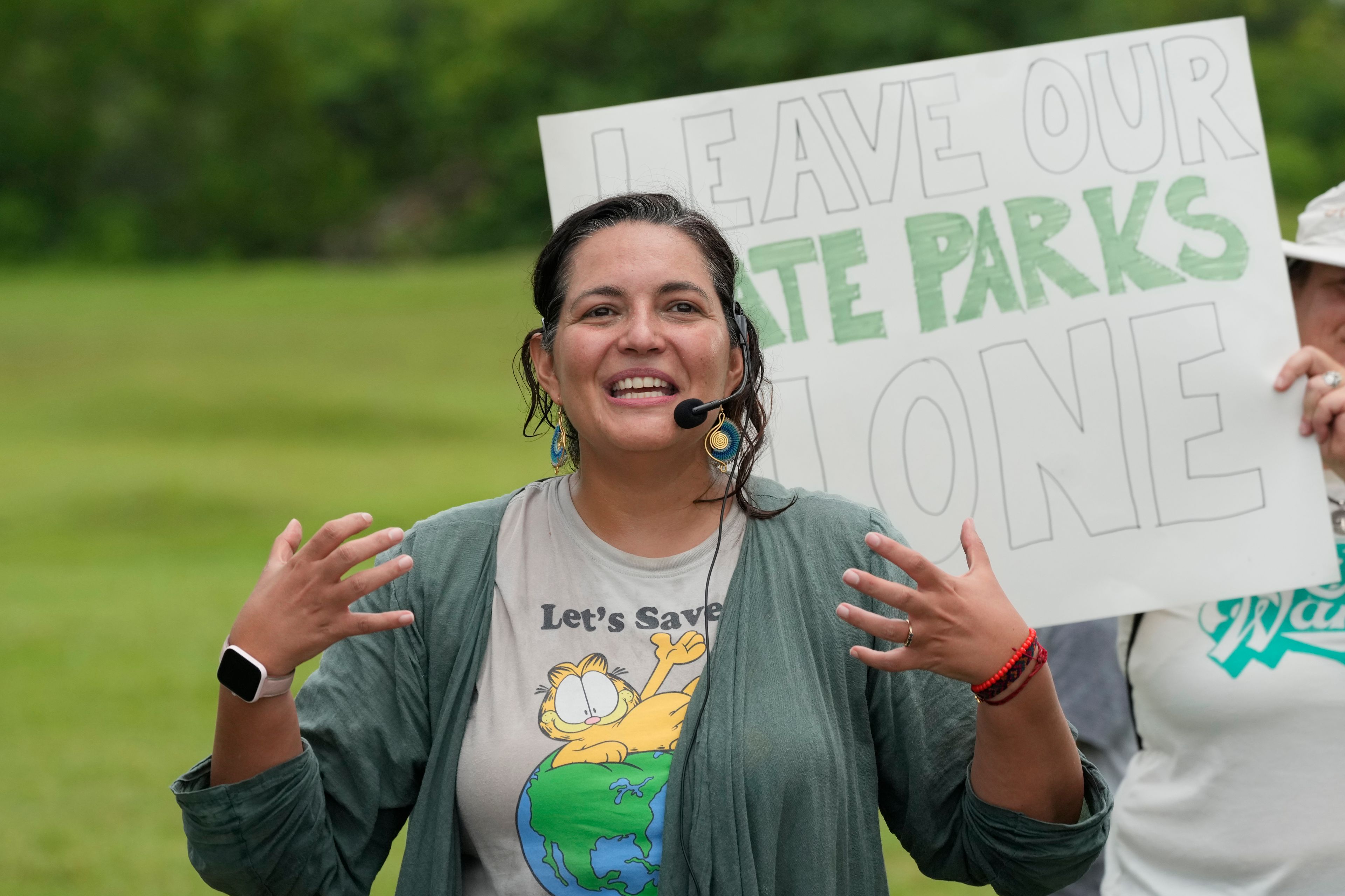 Catalina Lemaitre, the founder of Moms in Defense of Nature speaks, during a protest against Gov. Ron DeSantis' plan to develop state parks with business ventures such as golf courses, pickleball courts and large hotels, during a demonstration at Oleta River State Park, Tuesday, Aug. 27, 2024, in North Miami Beach, Fla.