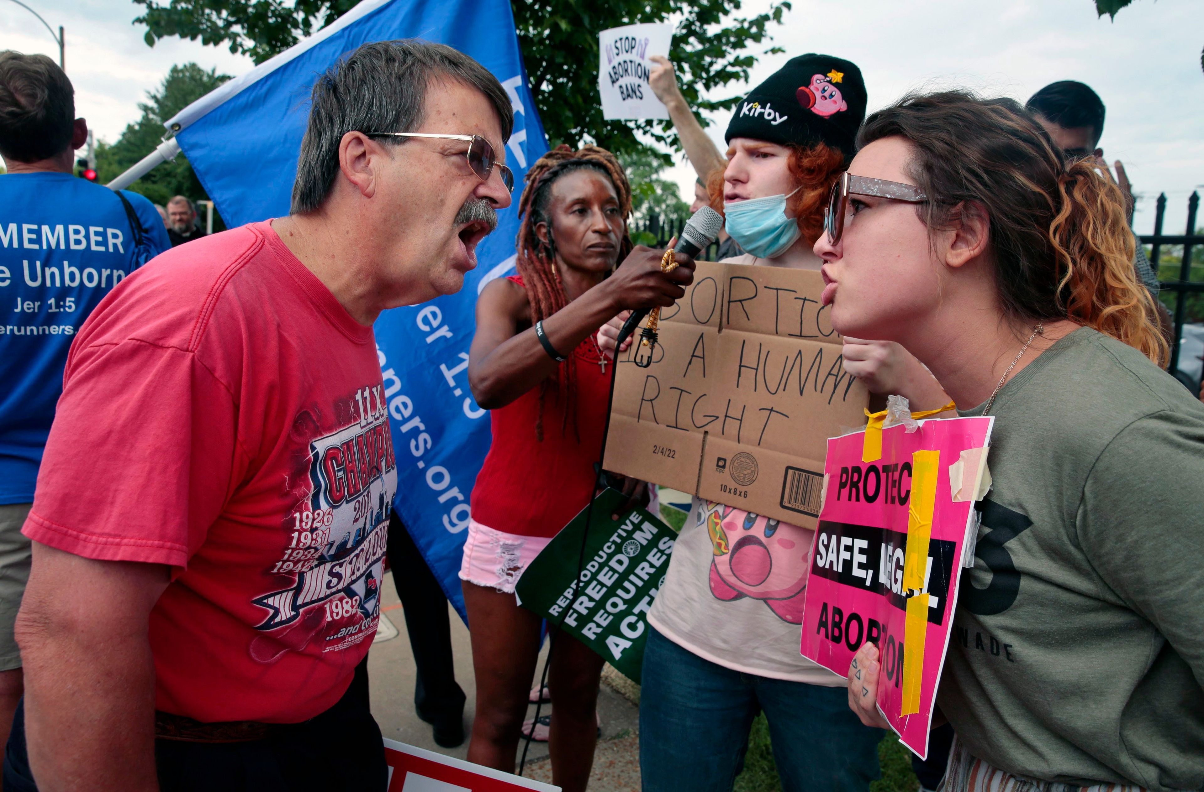 FILE - Steve Sallwasser, of Arnold, debates Brittany Nickens, of Maplewood, during competing rallies outside Planned Parenthood of Missouri, following the U.S. Supreme Court decision to overturn Roe v. Wade, June 24, 2022, in St. Louis. (Robert Cohen/St. Louis Post-Dispatch via AP, File)