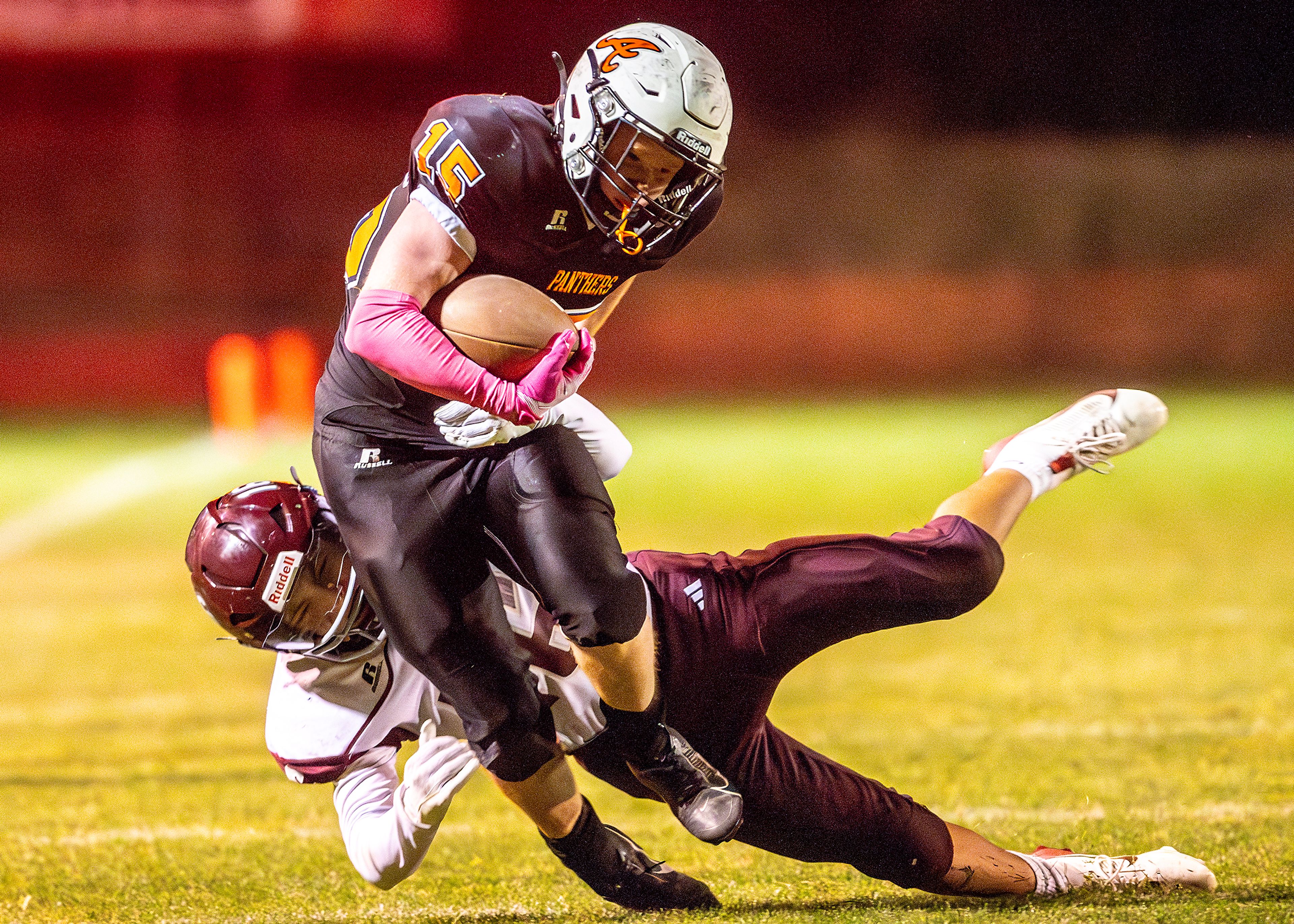 Asotin running back Carson Reedy runs the ball as Reardan�s HK Bird attempts to tackle him during a Northeast 2B game Friday in Asotin.,