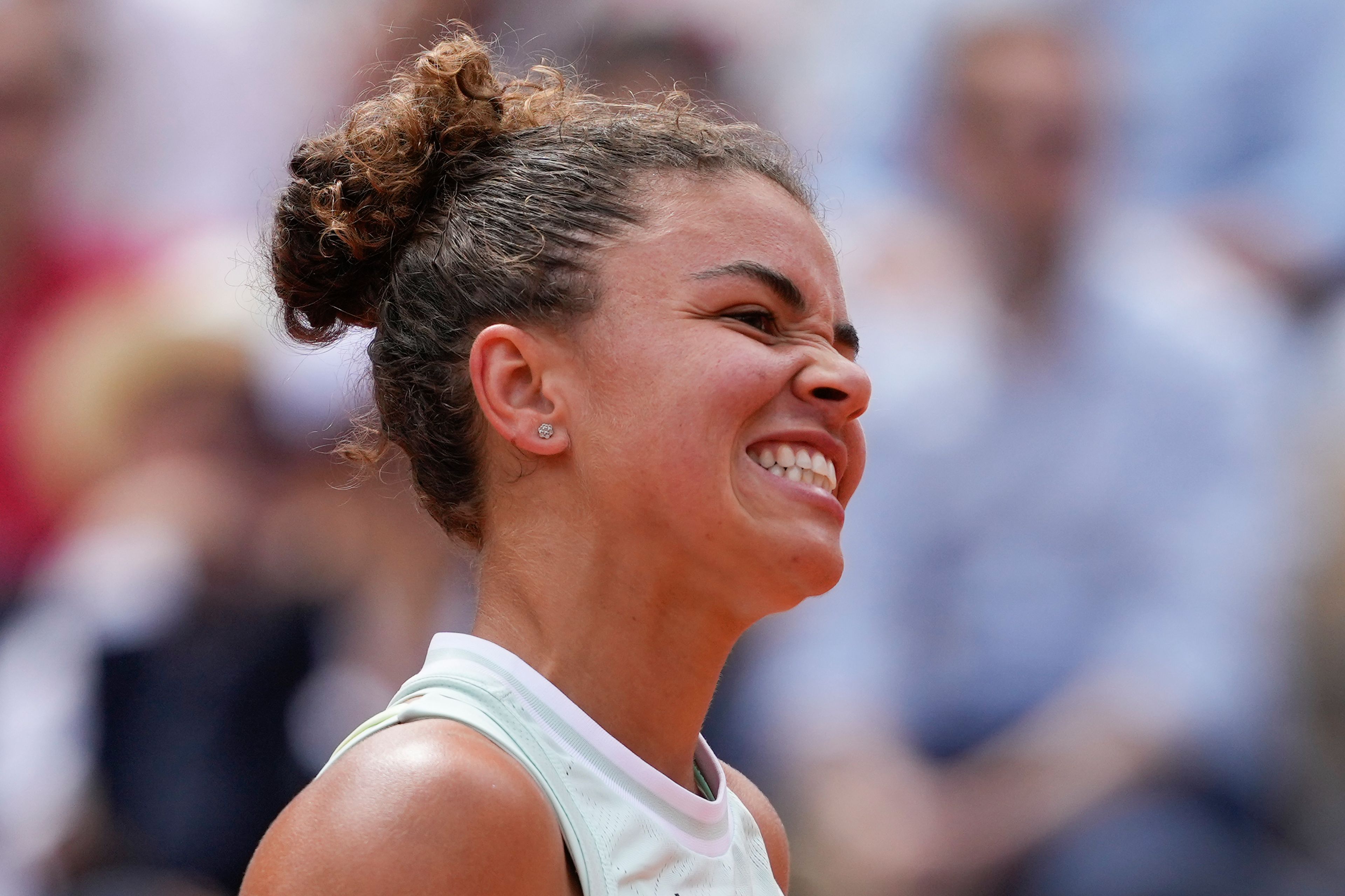 Italy's Jasmine Paolini reacts after missing a shot against Poland's Iga Swiatek during the women's final of the French Open tennis tournament at the Roland Garros stadium in Paris, France, Saturday, June 8, 2024.