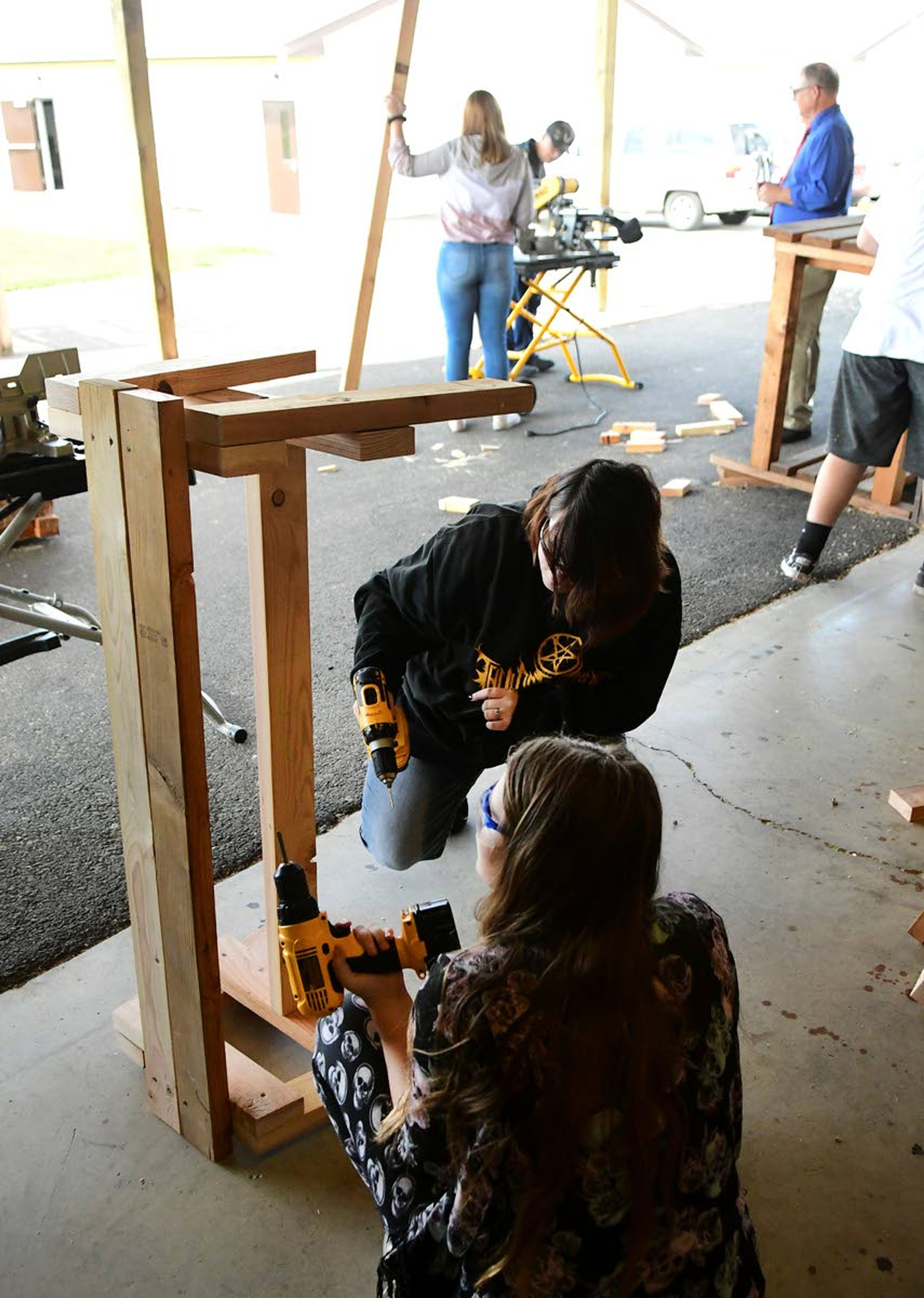 Students at Tammany High School learn woodworking skills while building benches and other projects.