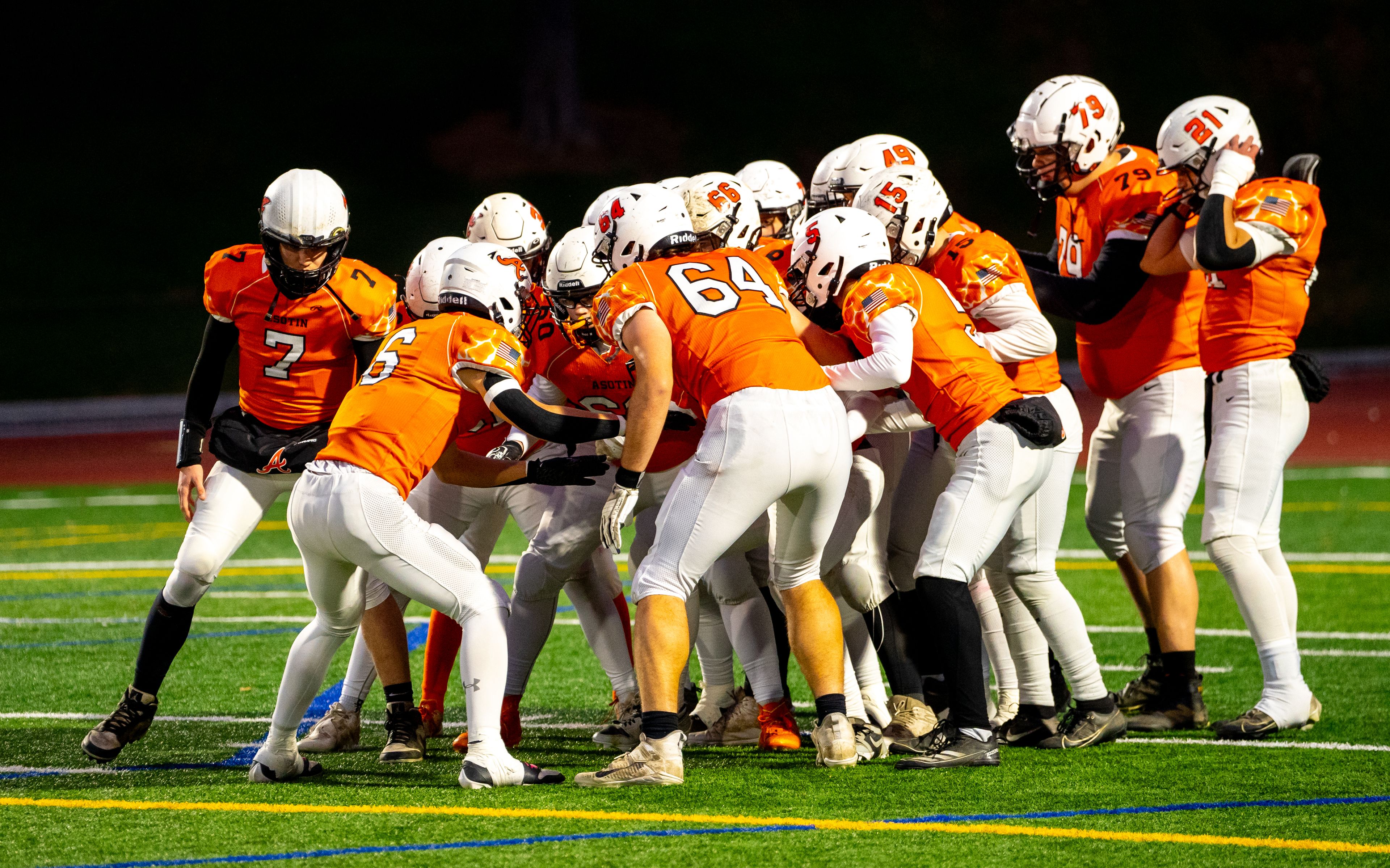 Asotin huddles up during a semifinal game against Napavine in the Washington 2B state tournament Saturday in Richland.