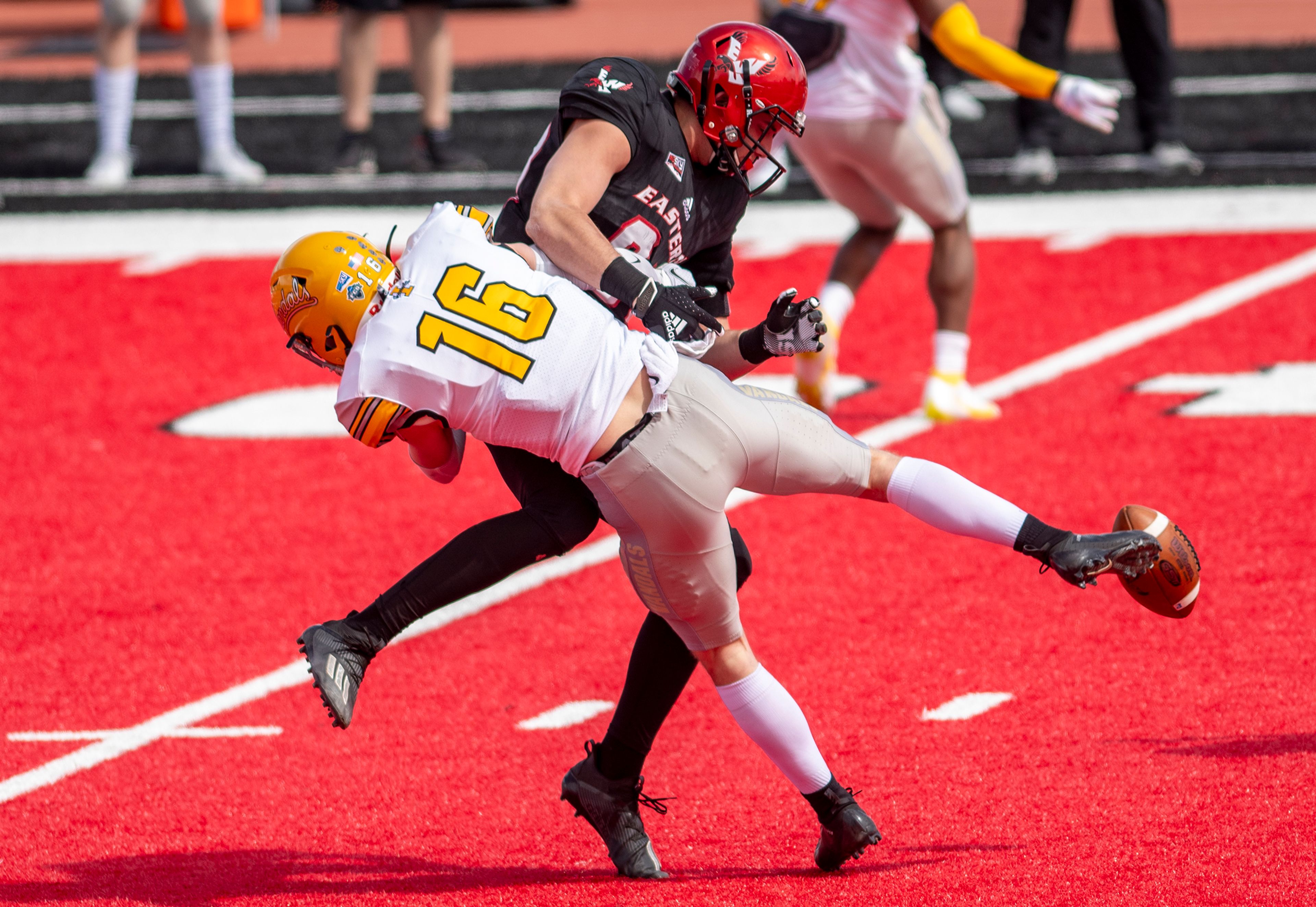 Idaho defensive back Jaxon Woodward (16) breaks a pass up after hitting Eastern Washington tight end Blake Gobel (82) during the first quarter of a Big Sky Conference matchup at Roos Field on Saturday afternoon. Eastern Washington defeated Idaho 38-31.