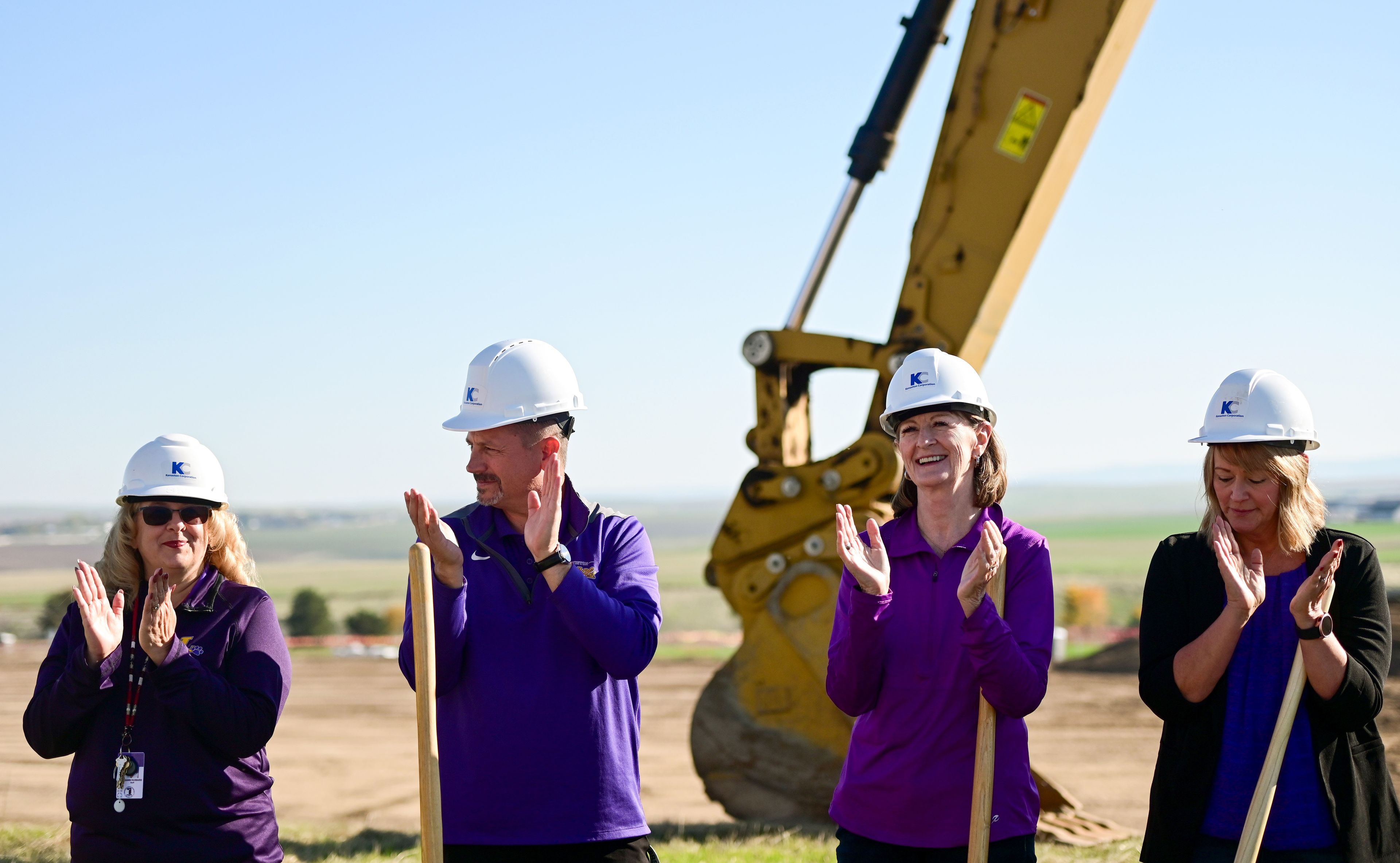 Key players in Lewiston School District and the beginning of Phase II construction on Lewiston High School’s athletic venues clap along to the school’s fight song after turning dirt at a groundbreaking celebration on Saturday.