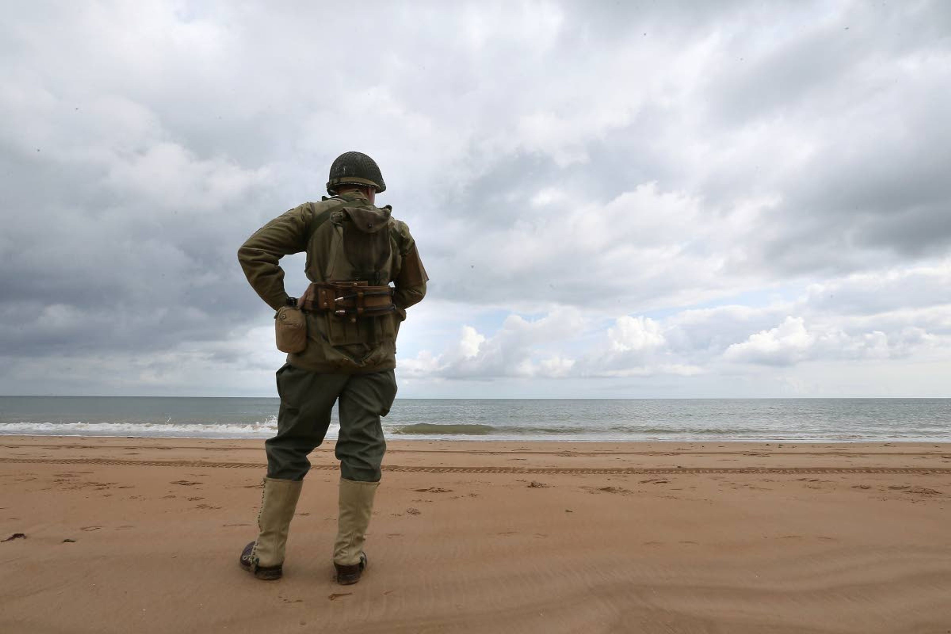 French enthusiast Julien watches the English channnel from Omaha beach, Normandy, Wednesday June 5, 2019. Extensive commemorations are being held in the U.K. and France to honor the nearly 160,000 troops from Britain, the United States, Canada and other nations who landed in Normandy on June 6, 1944 in history's biggest amphibious invasion. (AP Photo/David Vincent)