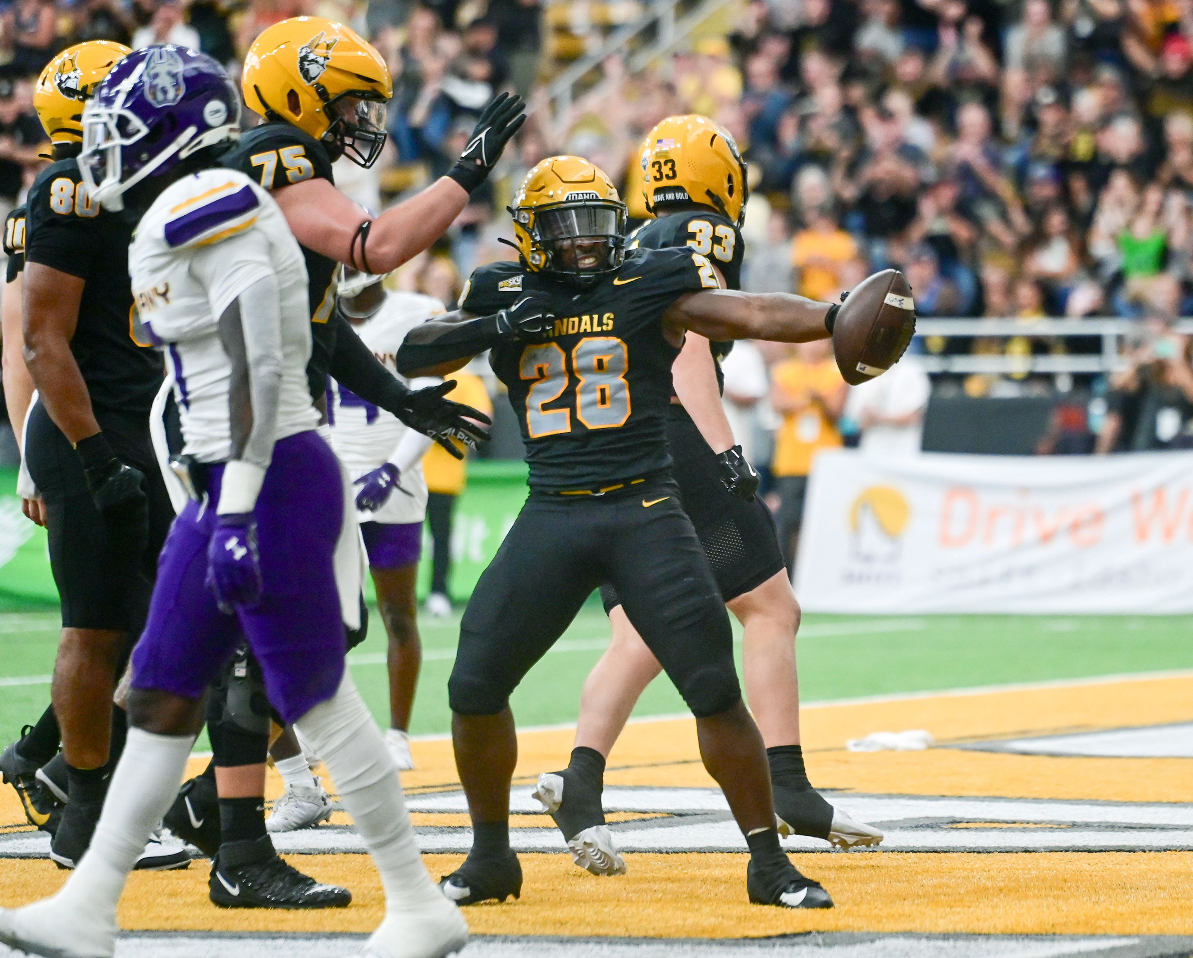 Idaho Vandals running back Nate Thomas (28) celebrates a touchdown against the Albany Great Danes on Sept. 14 at the P1FCU Kibbie Dome in Moscow.