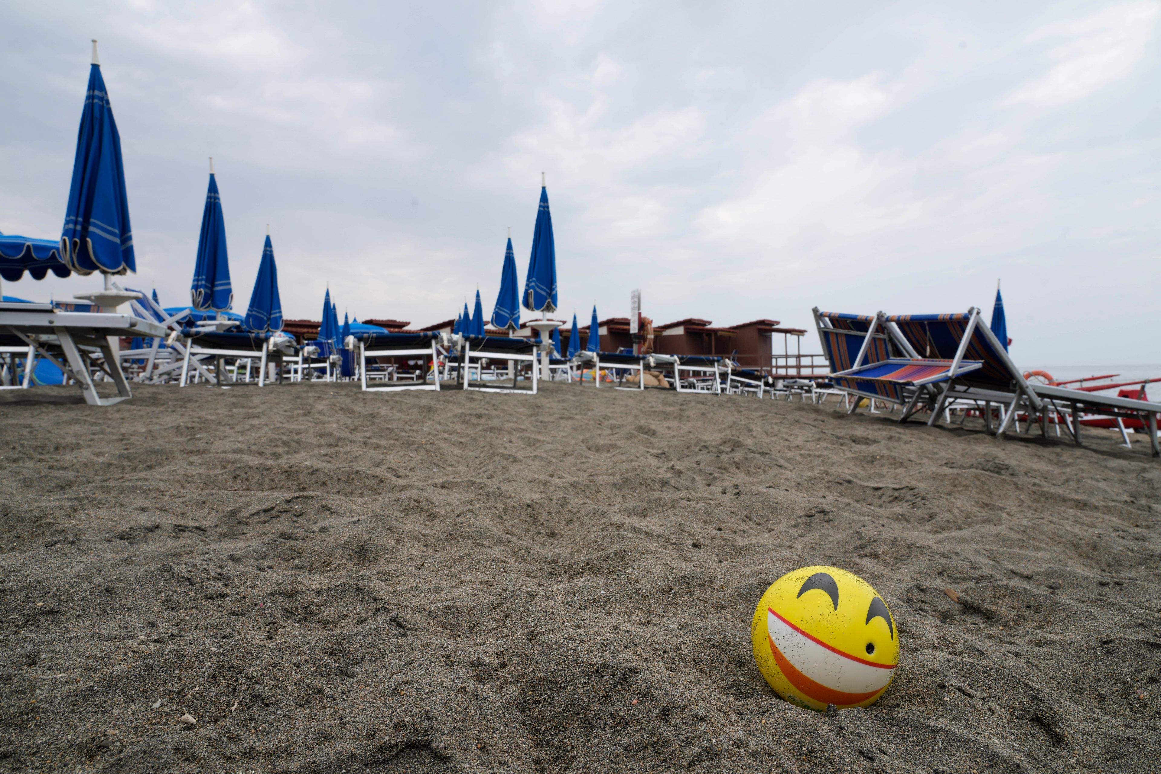 Umbrellas and sun beds are set at the Venezia beach establishment in Ostia, near Rome, Friday, Aug. 16, 2024.