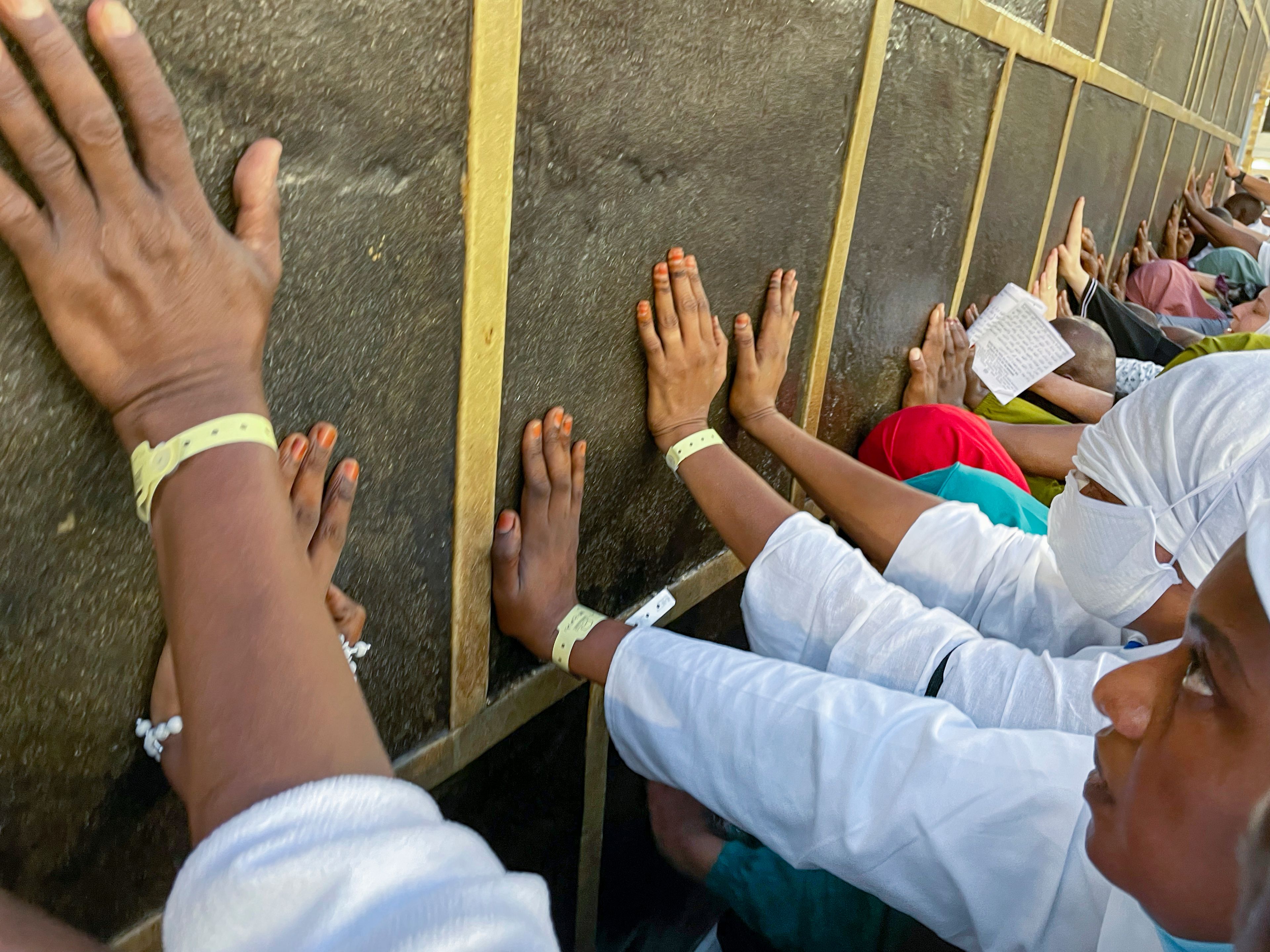 FILE - Muslim pilgrims pray in front of the Kaaba, the cubic building at the Grand Mosque, during the annual Hajj pilgrimage, in Mecca, Saudi Arabia, on June 25, 2023. Once a year, Muslim pilgrims coming to Saudi Arabia from around the world unite in a series of religious rituals and acts of worship as they perform Hajj, one of the pillars of Islam.