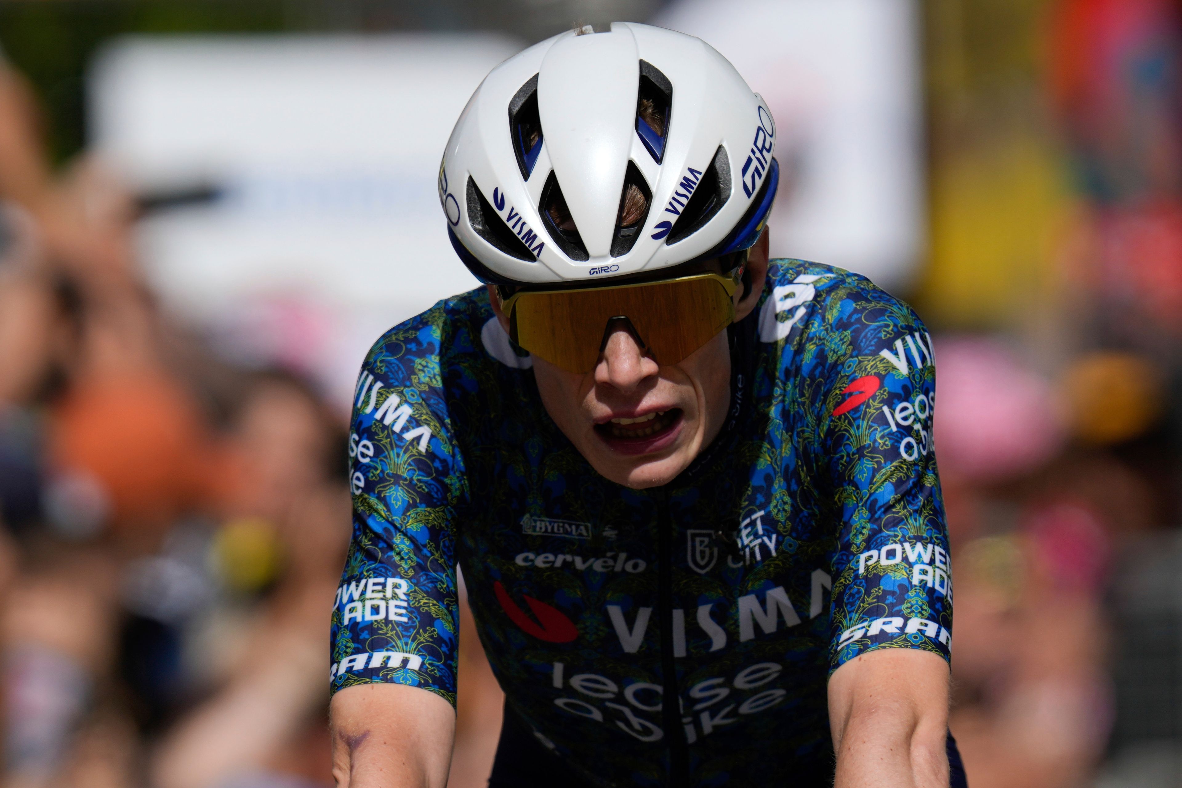 Denmark's Jonas Vingegaard reacts as he crosses the finish line of the fourth stage of the Tour de France cycling race over 139.6 kilometers (86.7 miles) with start in Pinerolo, Italy and finish in Valloire, France, Tuesday, July 2, 2024. (AP Photo/Jerome Delay)