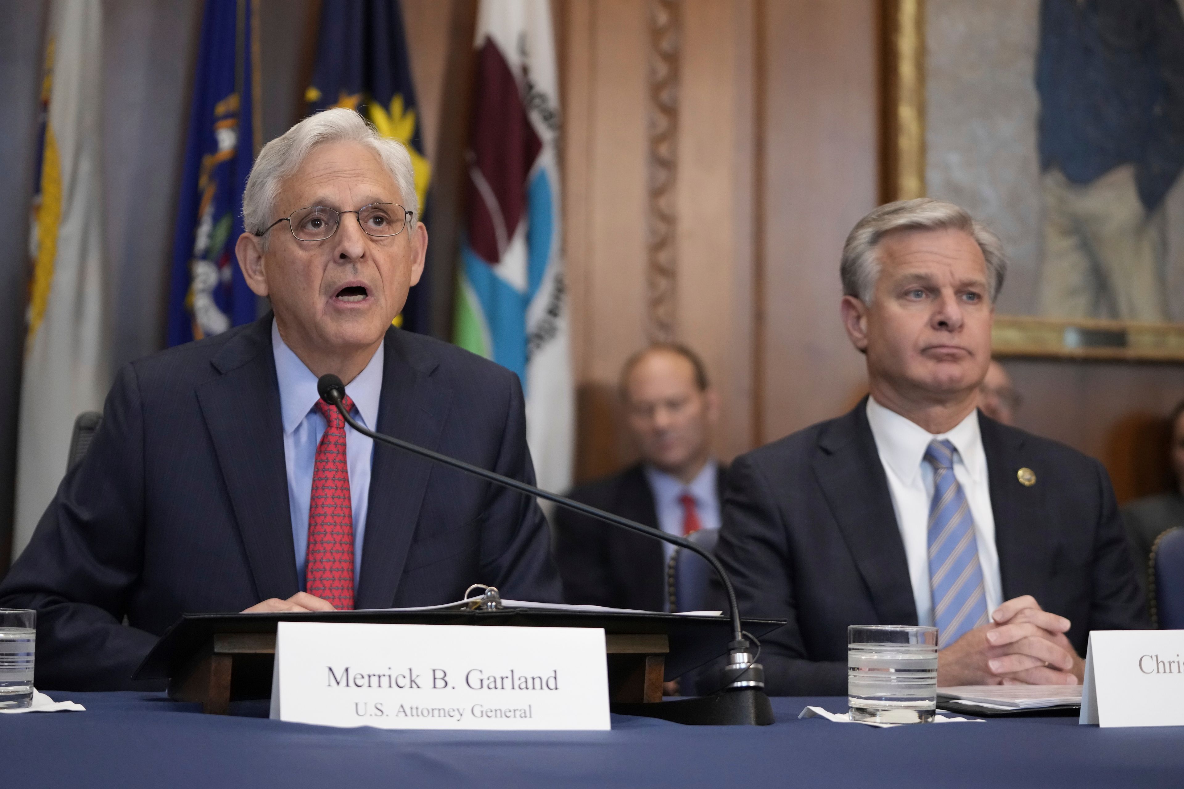 Attorney General Merrick Garland speaks during a meeting of the Justice Department's Election Threats Task Force, at the Department of Justice, Wednesday, Sept. 4, 2024, in Washington, with FBI Director Christopher Wray, right. (AP Photo/Mark Schiefelbein)