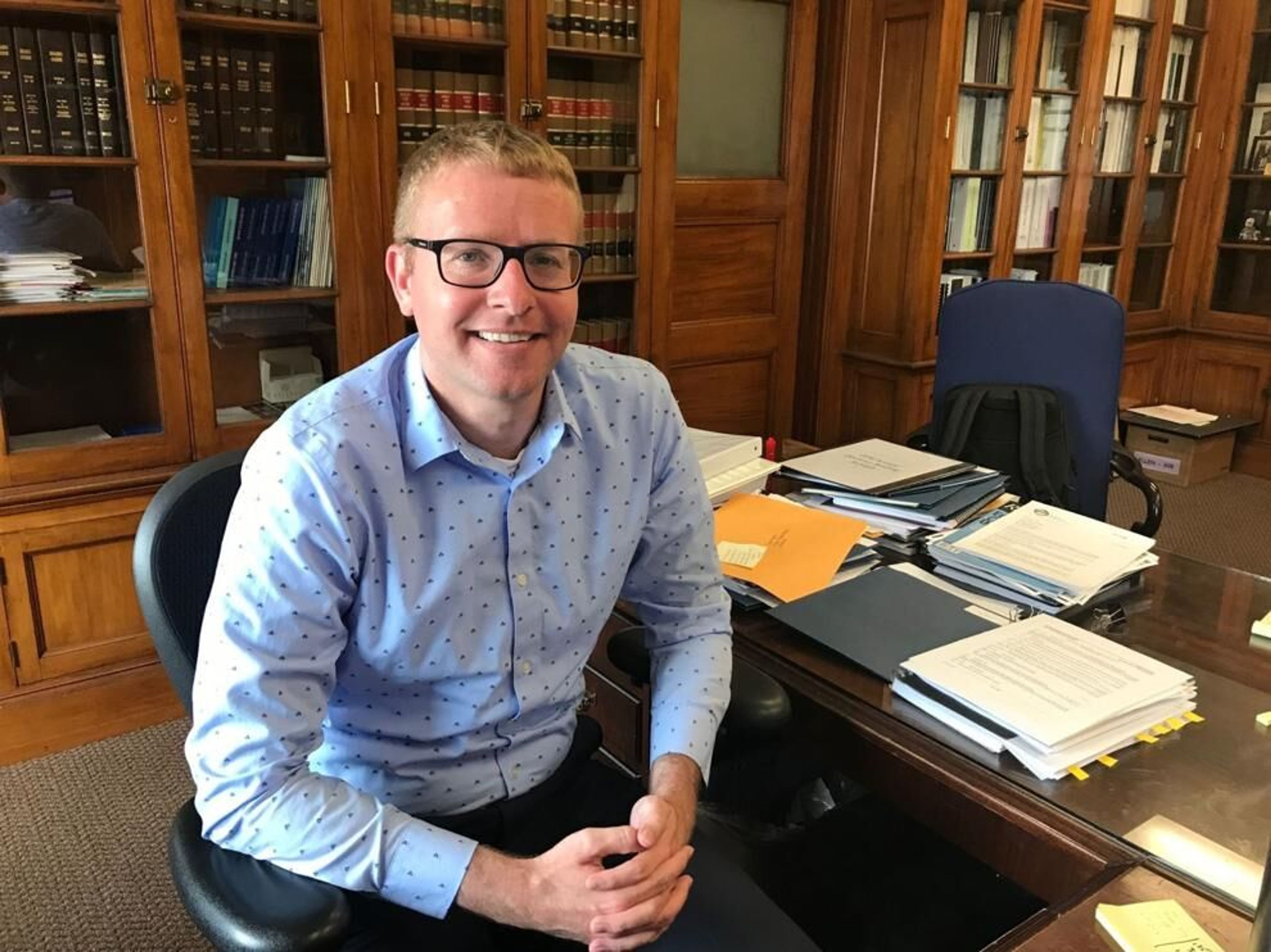 Alex Adams, who previously served as Gov. Brad Little’s budget chief, sits in his office in this June 2019 file photo. Adams became the new director of the Idaho Department of Health and Welfare on June 5.