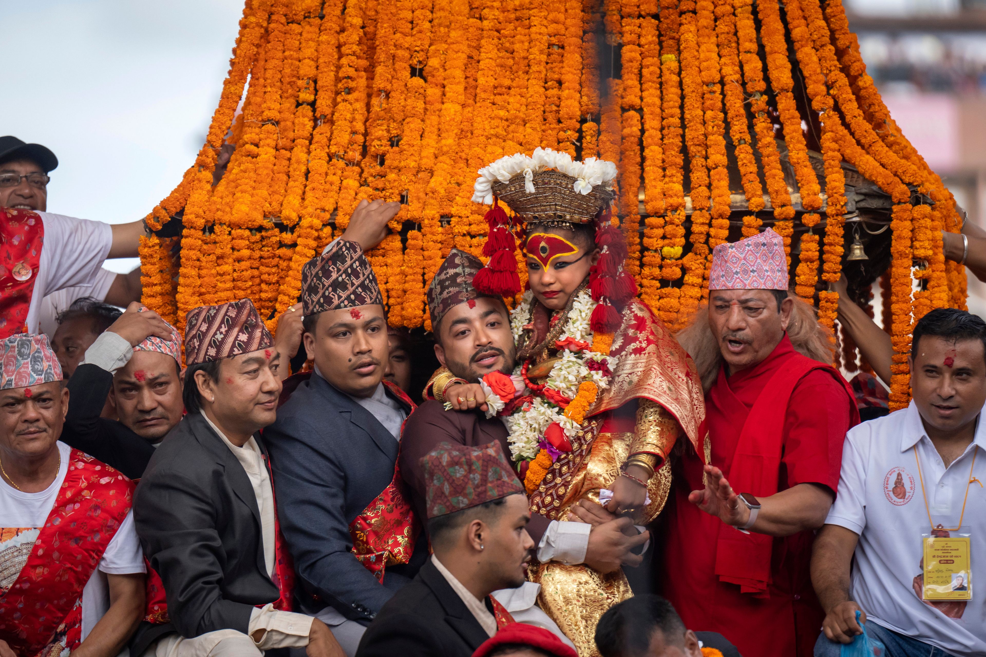 Living goddess Kumari reacts as she is being carried during Indra Jatra, a festival that marks the end of the rainy season in Kathmandu, Nepal, Tuesday, Sept. 17, 2024. (AP Photo/Niranjan Shrestha)