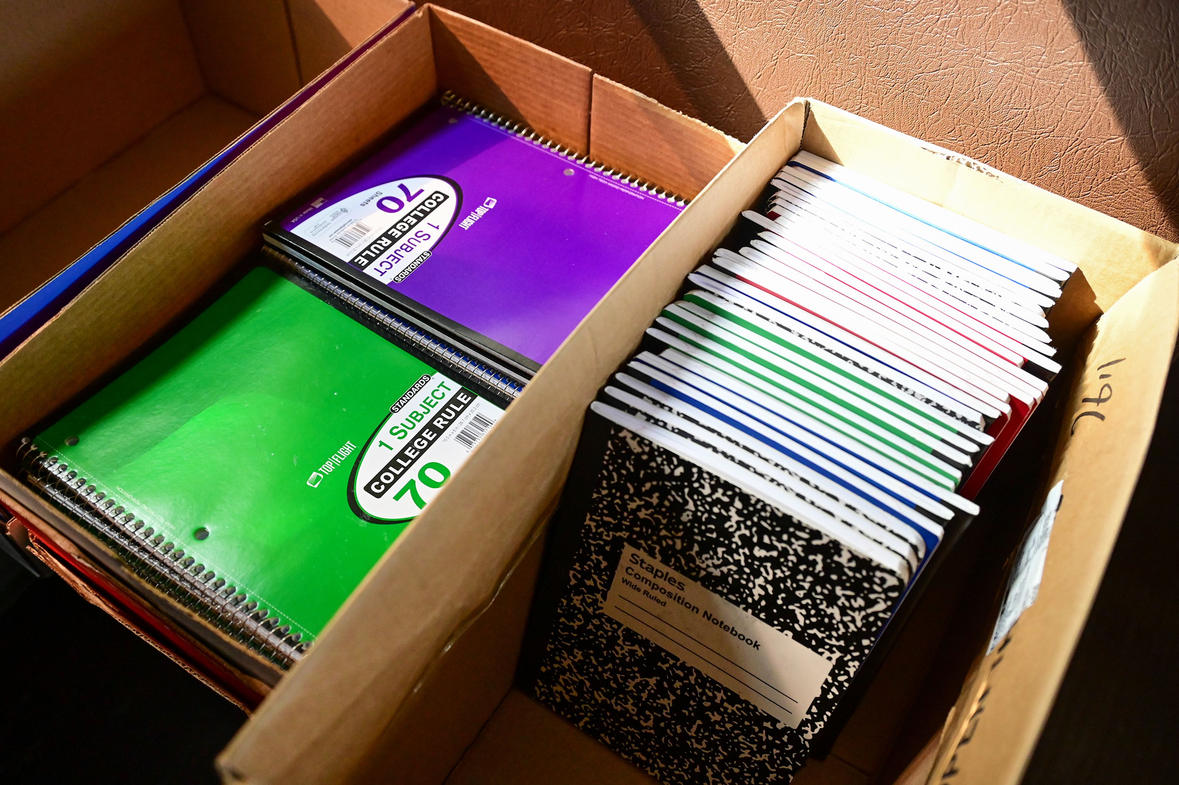 Donated notebooks for the Stuff the Bus school supplies drive are organized in the seats of a Moscow school district bus on Thursday in Moscow.