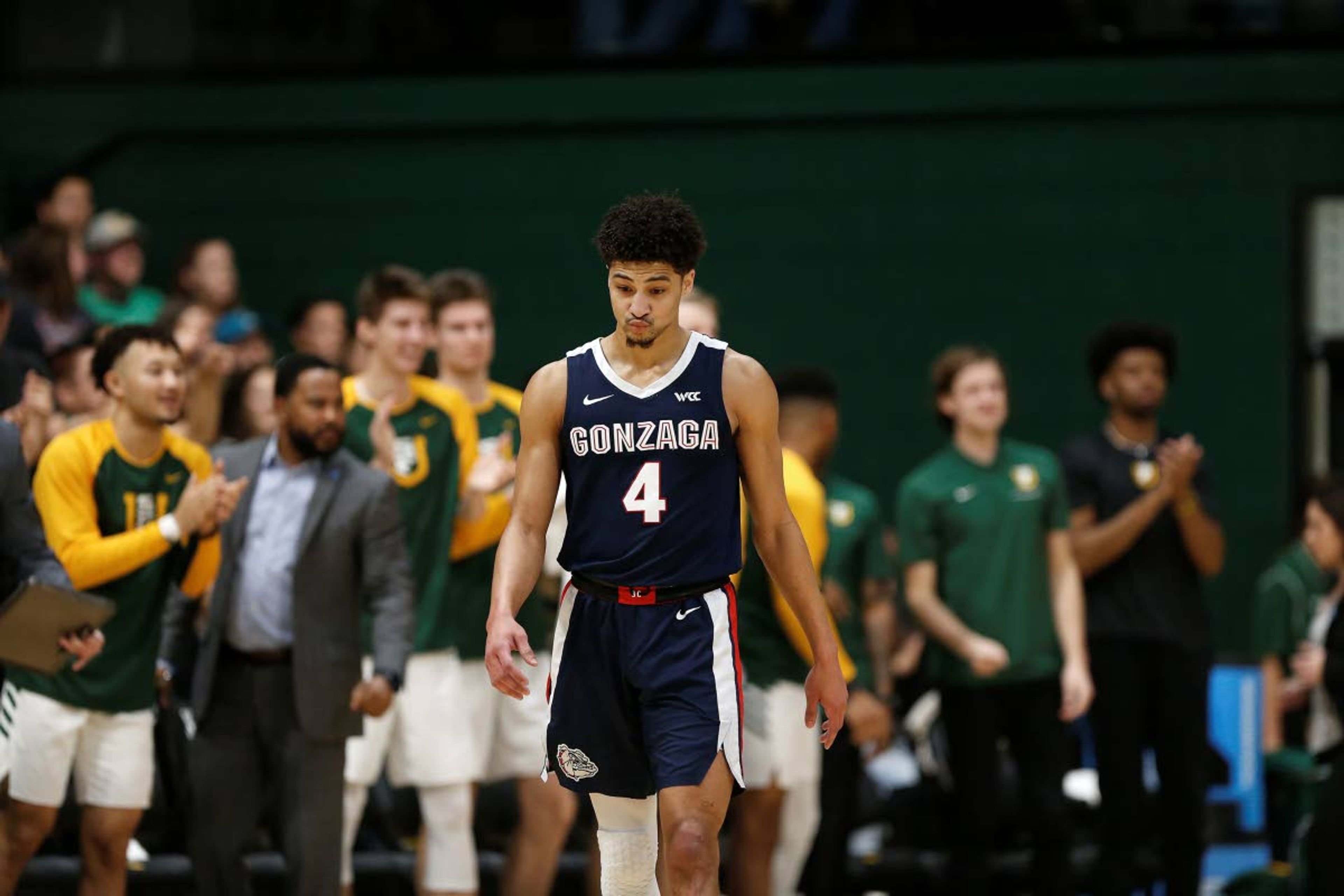 Gonzaga guard Ryan Woolridge (4) reacts during the first half of an NCAA college basketball game against San Francisco in San Francisco, Saturday, Feb. 1, 2020. (AP Photo/Jed Jacobsohn)