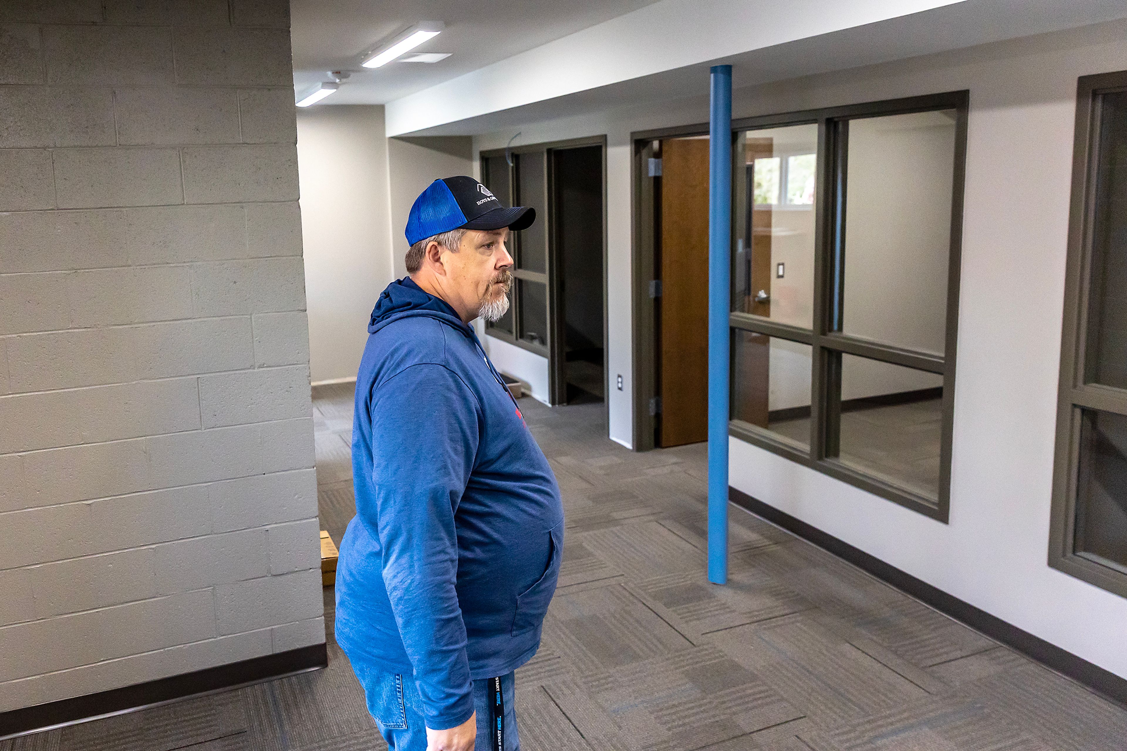 Jon Evans stands in the office spaces on the bottom story of Booth Hall Wednesday in Lewiston.