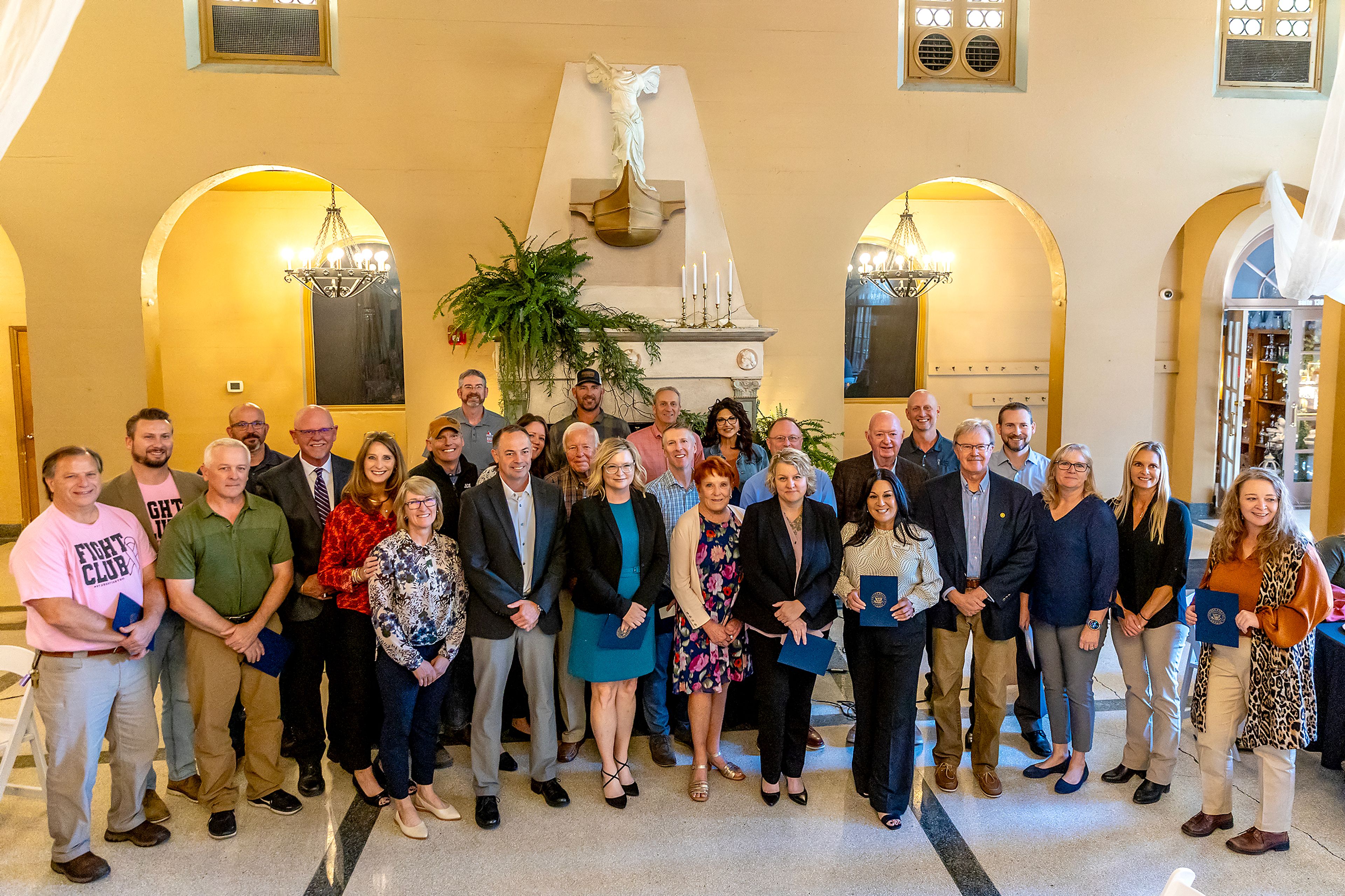 Representatives from 100-year-old businesses in the valley stand for a photo during a chamber of commerce event celebrating 100-year-old businesses Wednesday at the Lewis Clark Hotel in Lewiston.