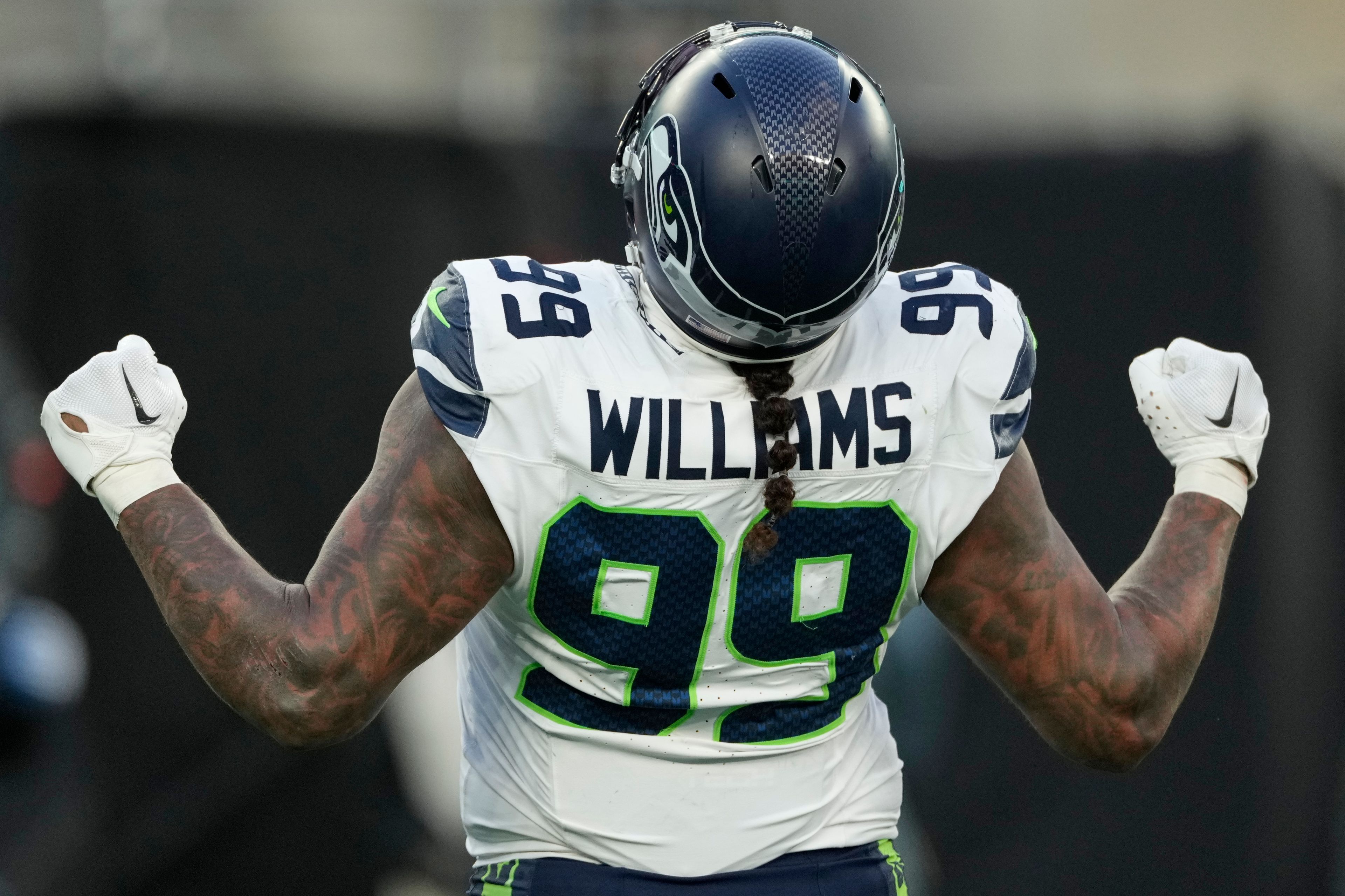 Seattle Seahawks defensive end Leonard Williams (99) reacts after sacking New York Jets quarterback Aaron Rodgers during the fourth quarter of an NFL football game, Sunday, Dec. 1, 2024, in East Rutherford, N.J. (AP Photo/Seth Wenig)