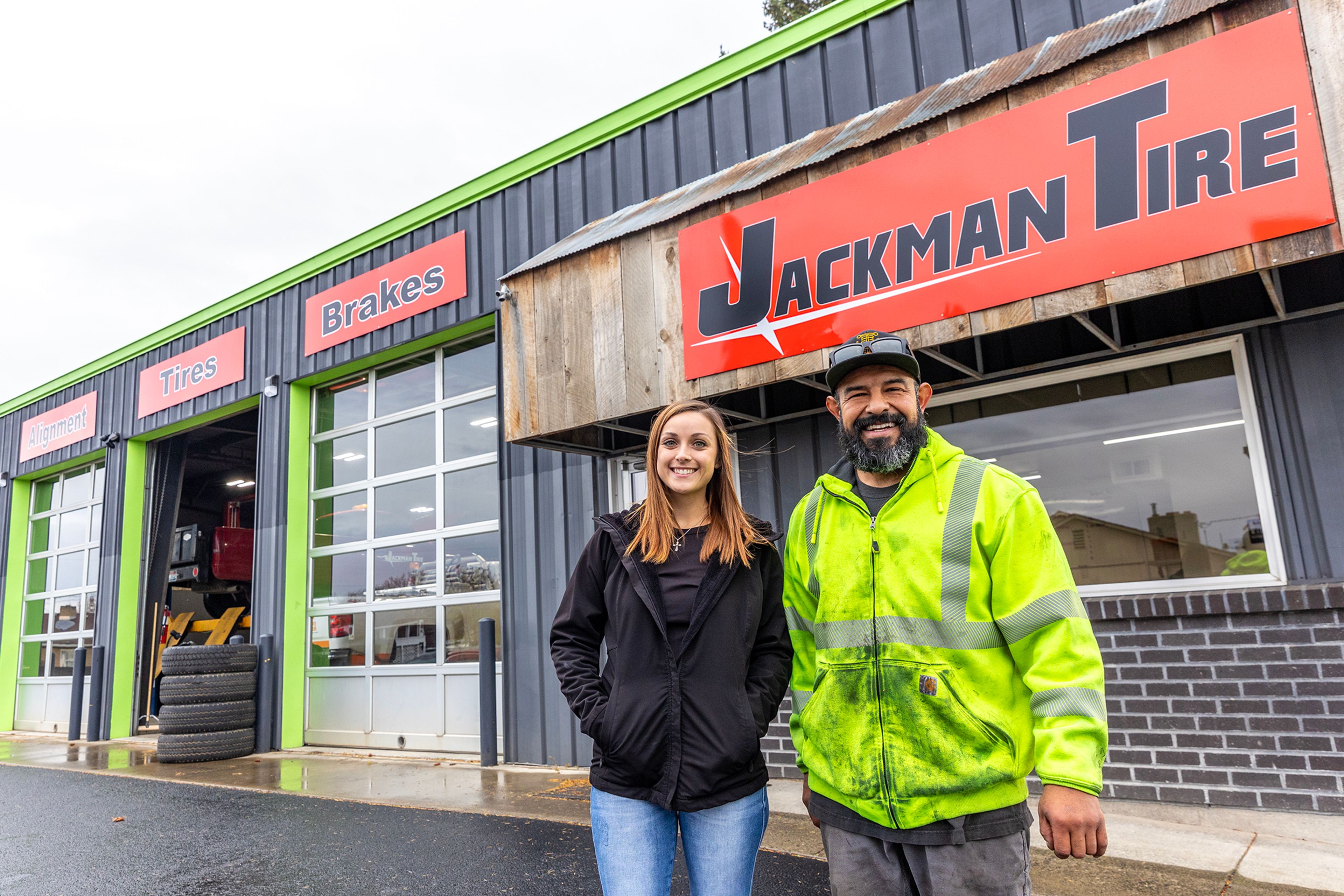 Meghan Garrett and Martin Flores pose for a photo outside Jackman Tire Thursday in the Lewiston Orchards.