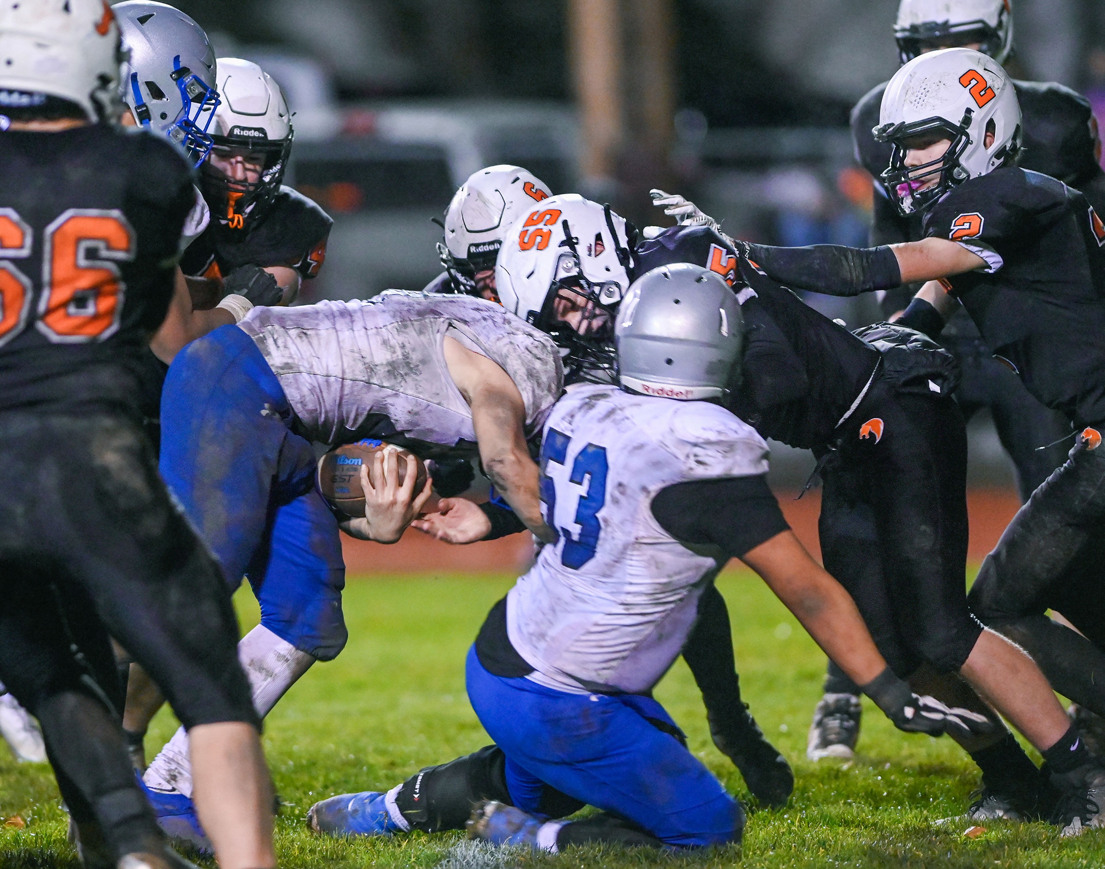 La Salle’s Adan Villalobos pushes against Asotin defenders, including Chase Engle, to cross into the end zone for a final touchdown Saturday in the Washington 2B state tournament game in Clarkston. Asotin then blocked an attempted two-point conversion from La Salle.