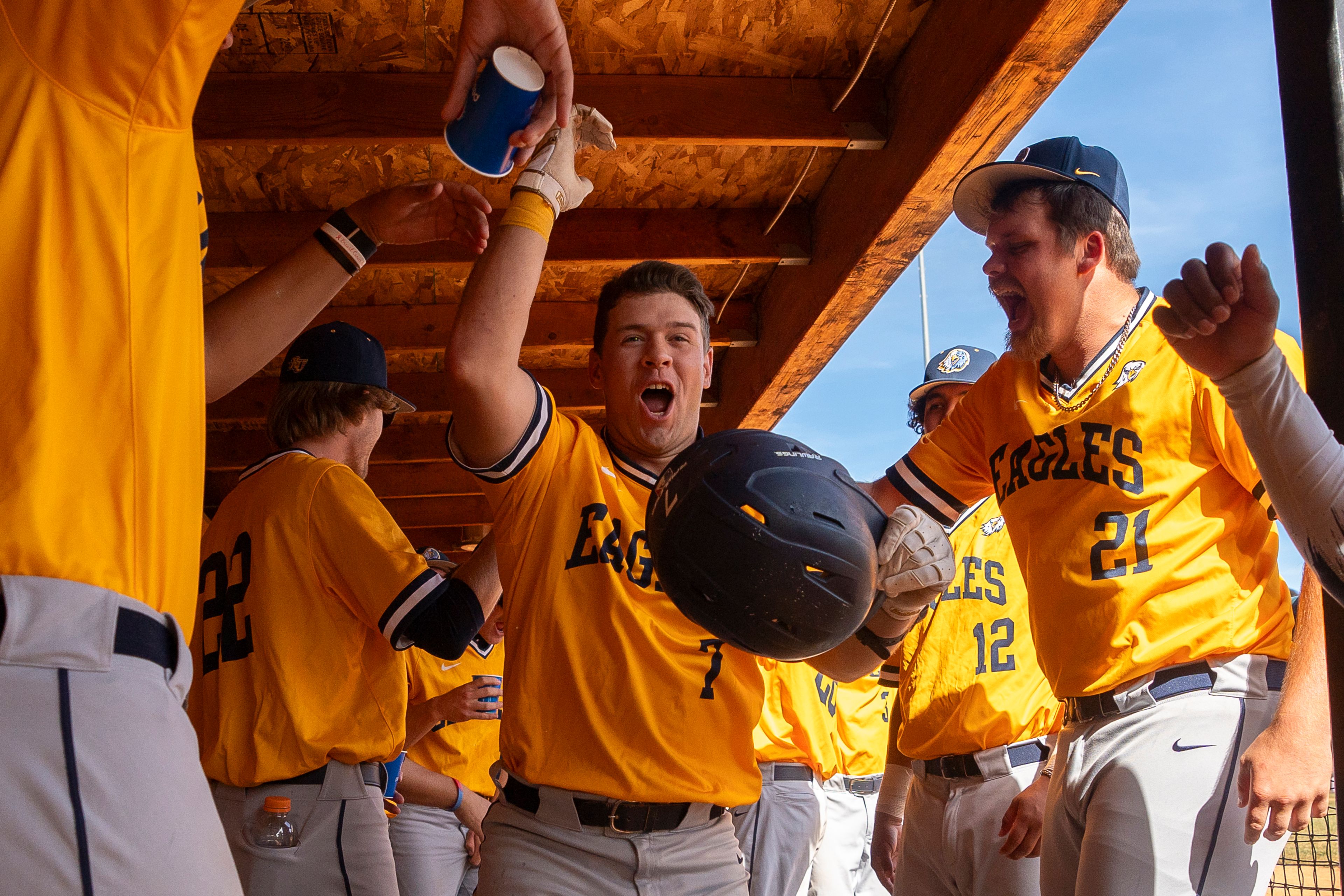 Reinhard's Tucker Zdunich, center, celebrates with teammates after hitting a home run during game 11 of the NAIA World Series against Arizona Christian on Monday at Harris Field in Lewiston.