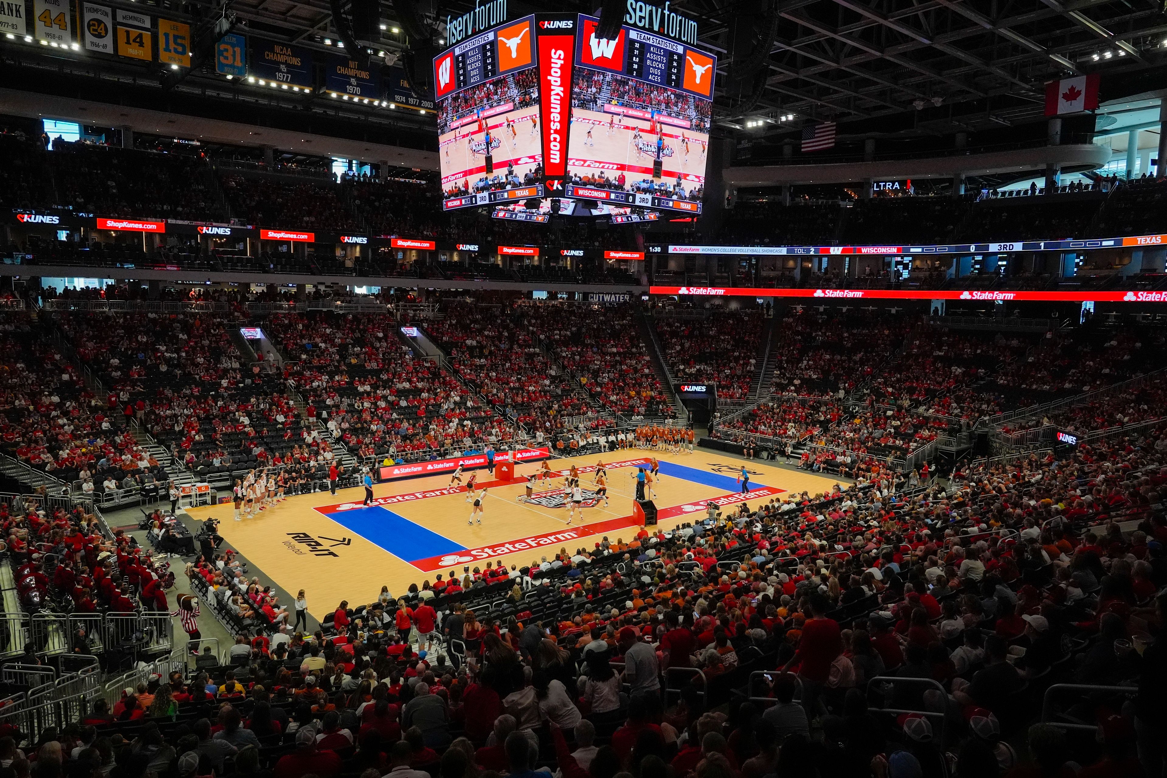 Fans in the Fiserv Forum watch during an NCAA Division I women's college volleyball game between Wisconsin and Texas Sunday, Sept. 1, 2024, in Milwaukee.